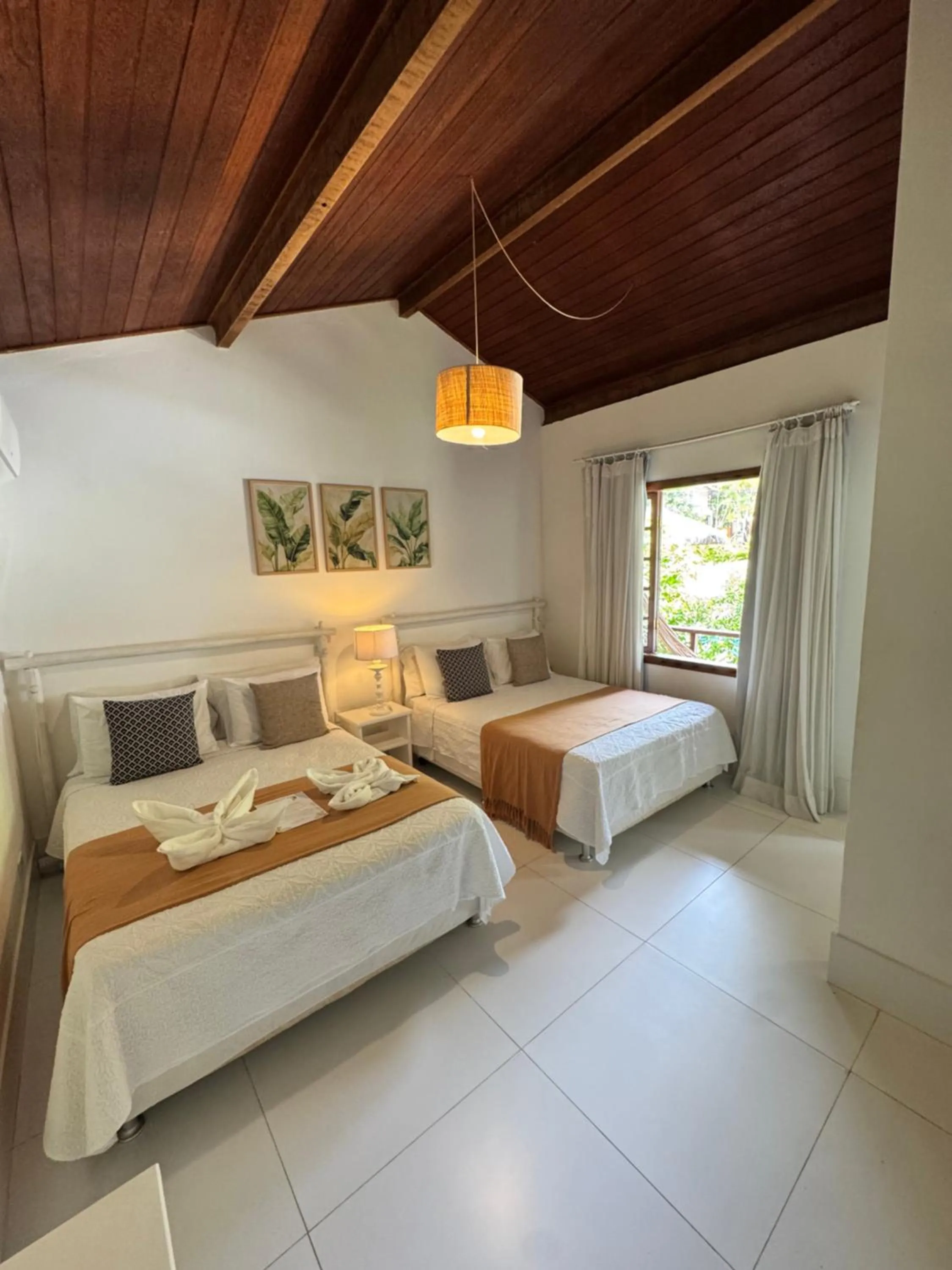 Bed in Pousada Coisa e Tao
