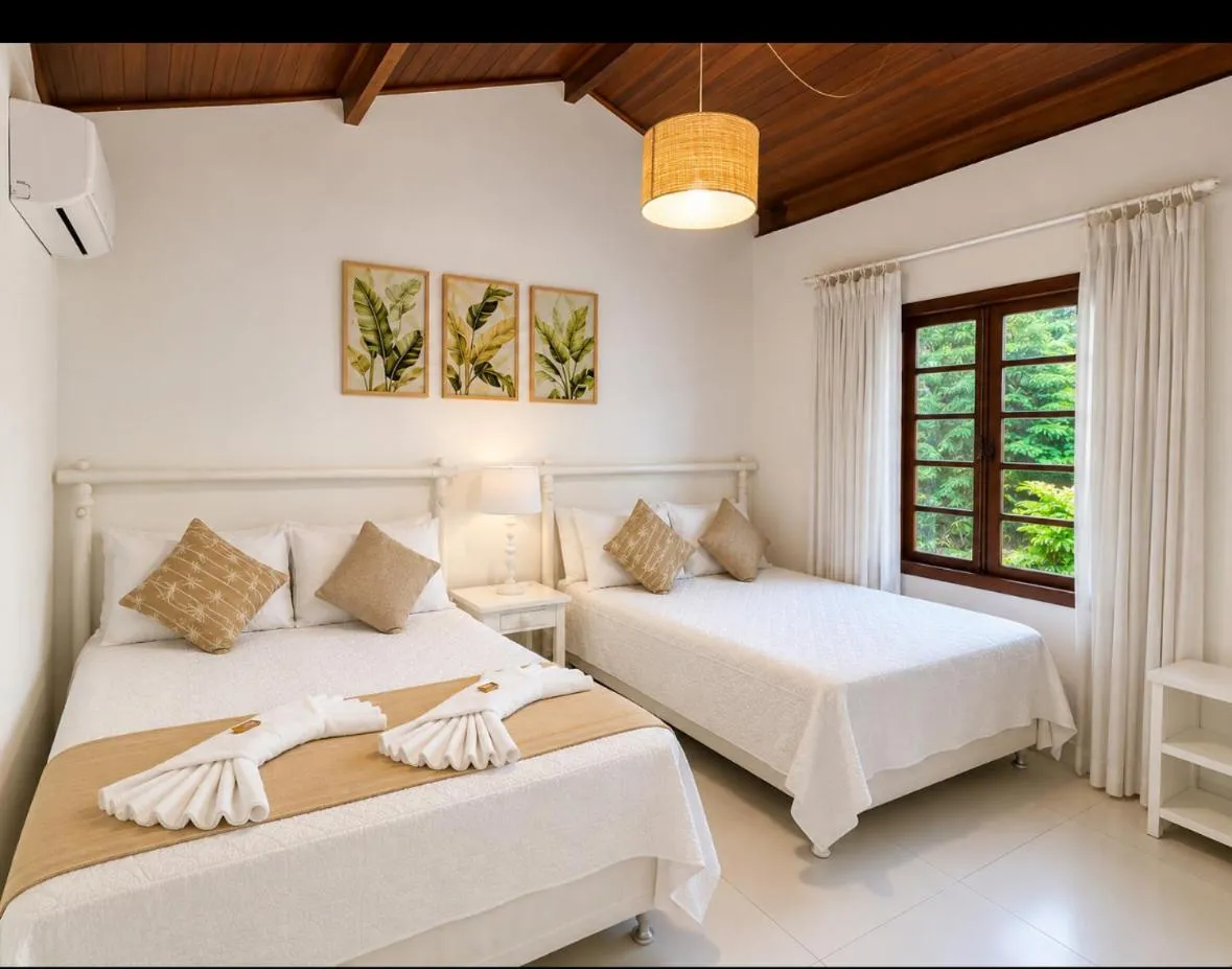 Bed in Pousada Coisa e Tao