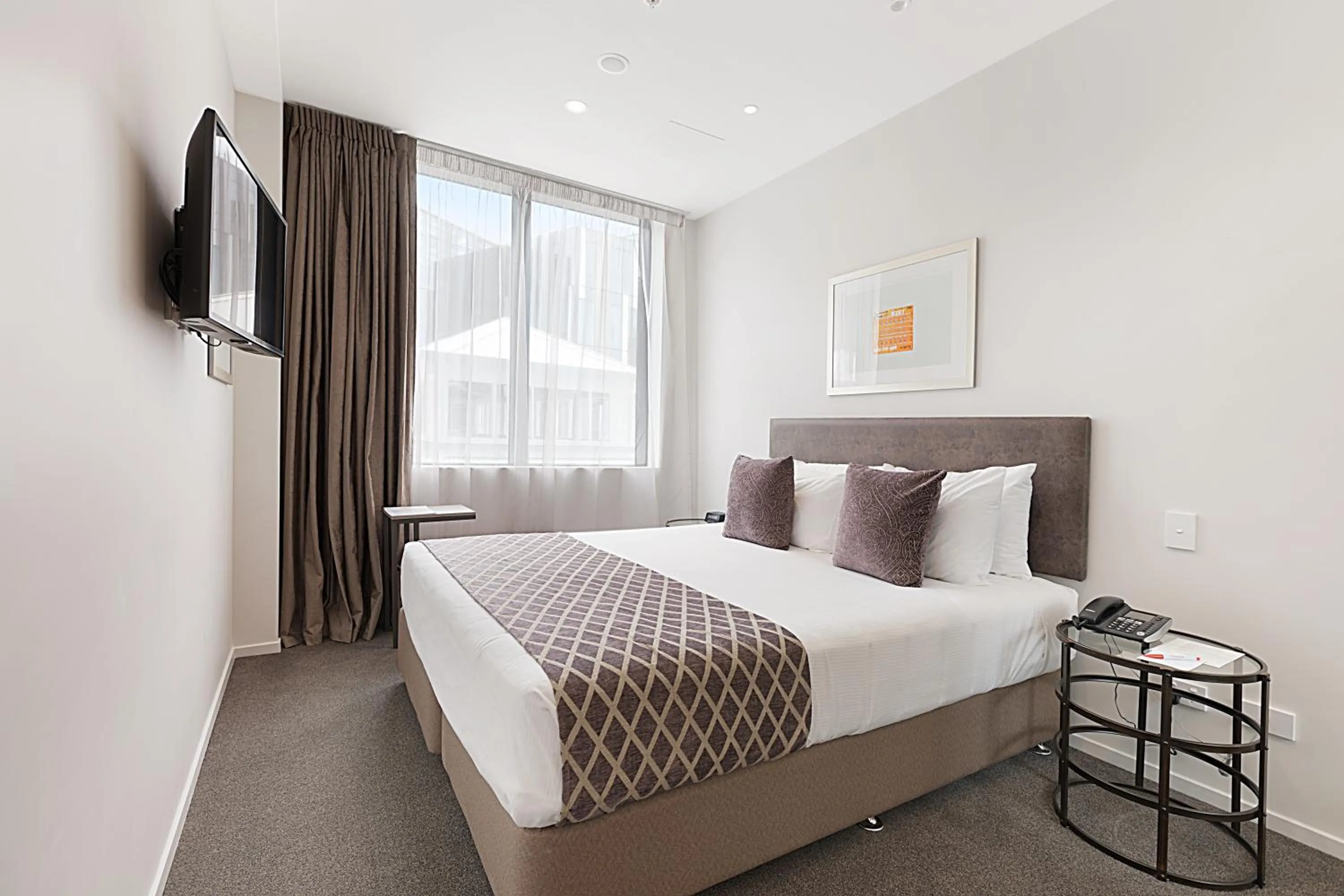 Bed in Ramada Suites By Wyndham Victoria Street West