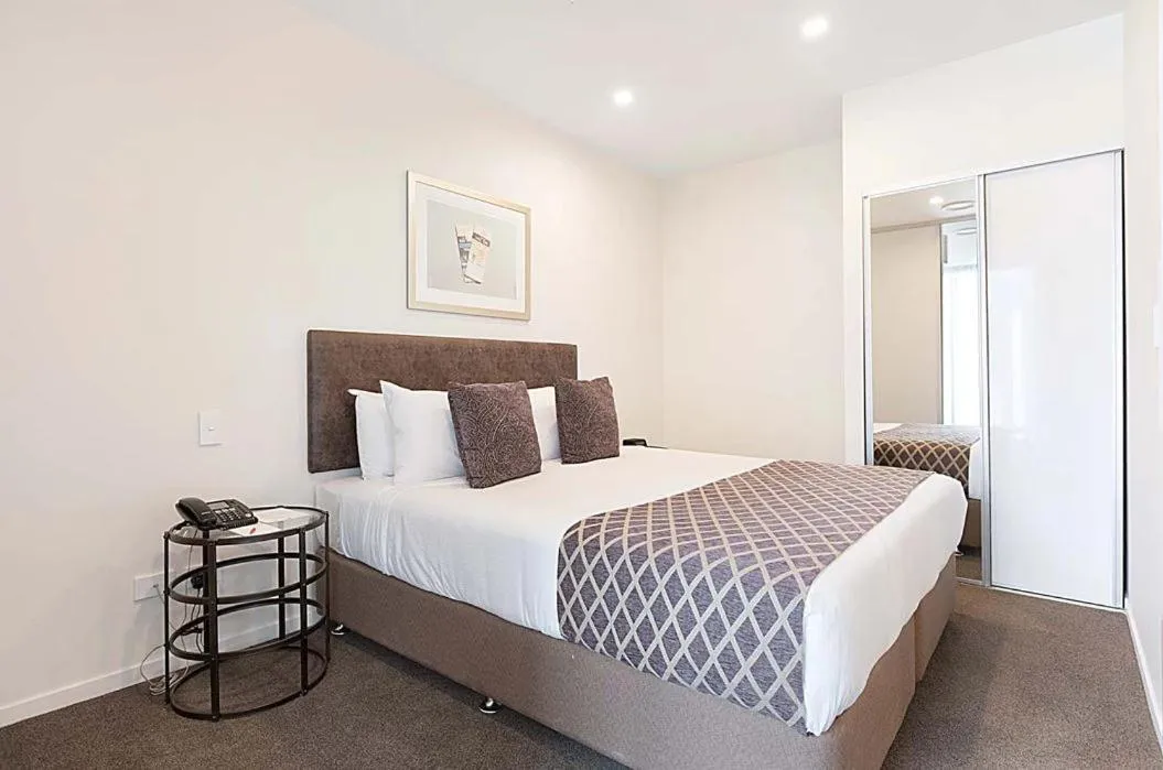 Bedroom, Bed in Ramada Suites By Wyndham Victoria Street West