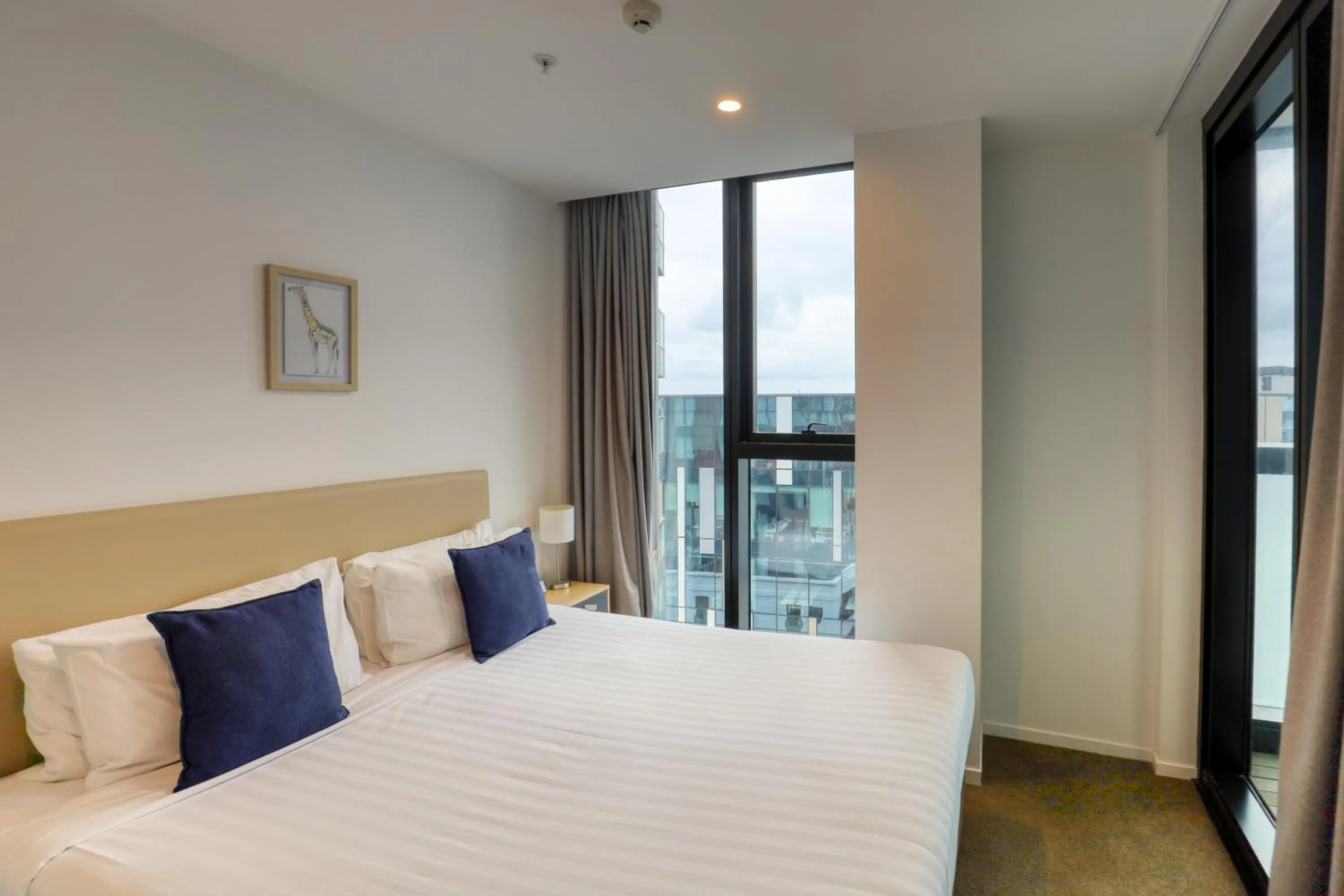 Bedroom, Bed in Ramada Suites By Wyndham Victoria Street West