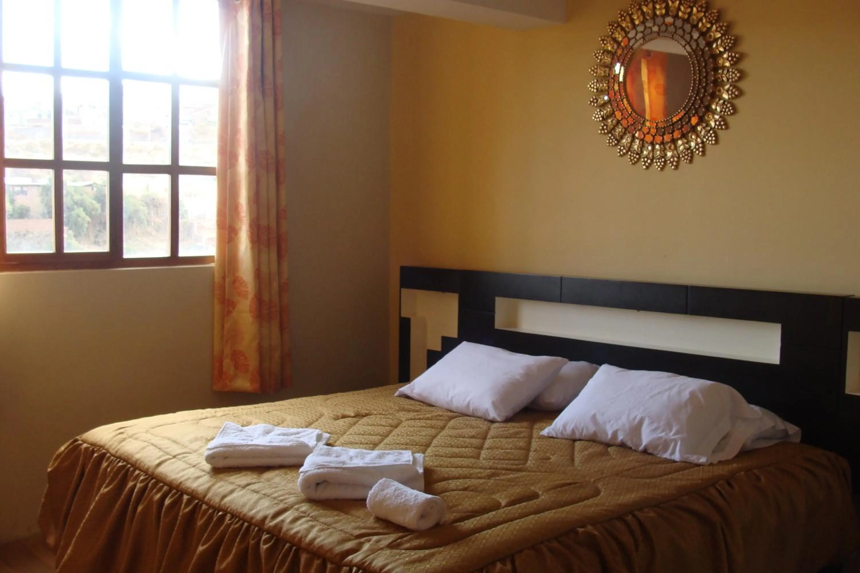 Bed in Hostal Qolqampata