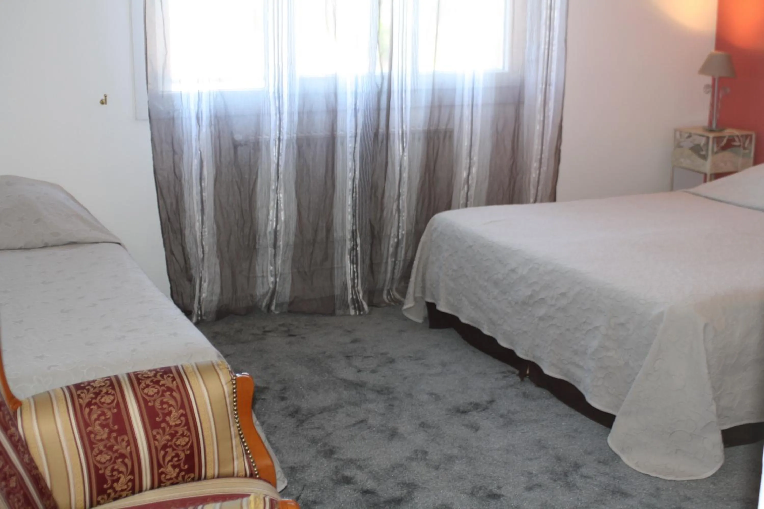 Bed in Logis Hotel du Midi