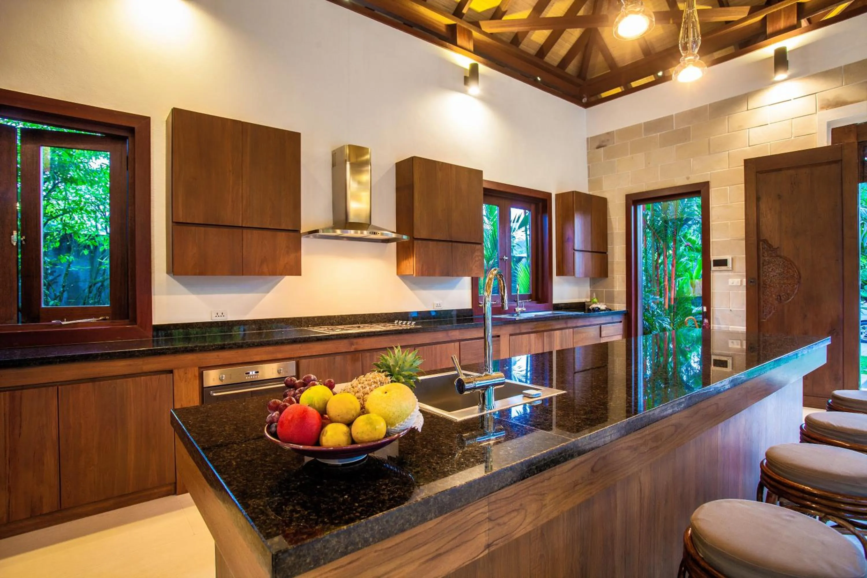 Kitchen or kitchenette in Baan Pinya Balinese Style Pool Villa