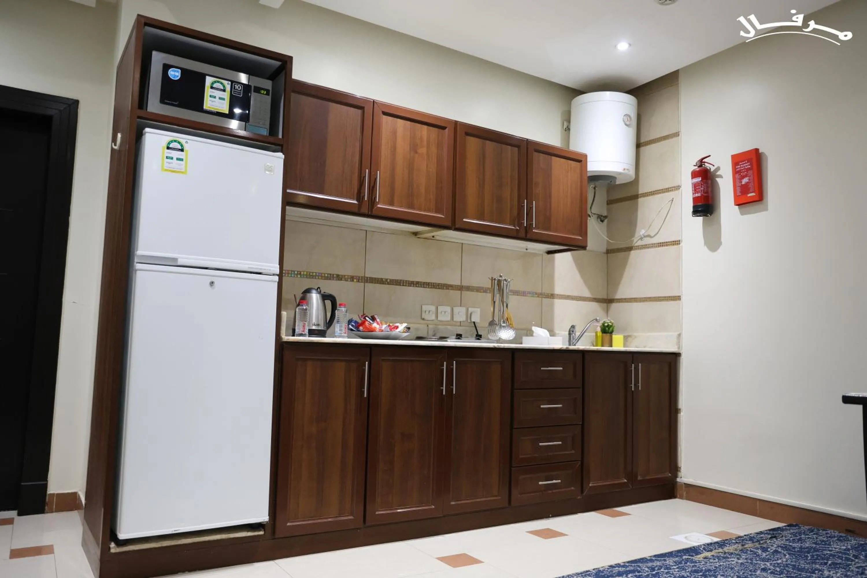 Kitchen or kitchenette in Merfal Hotel Apartments Al Taawan