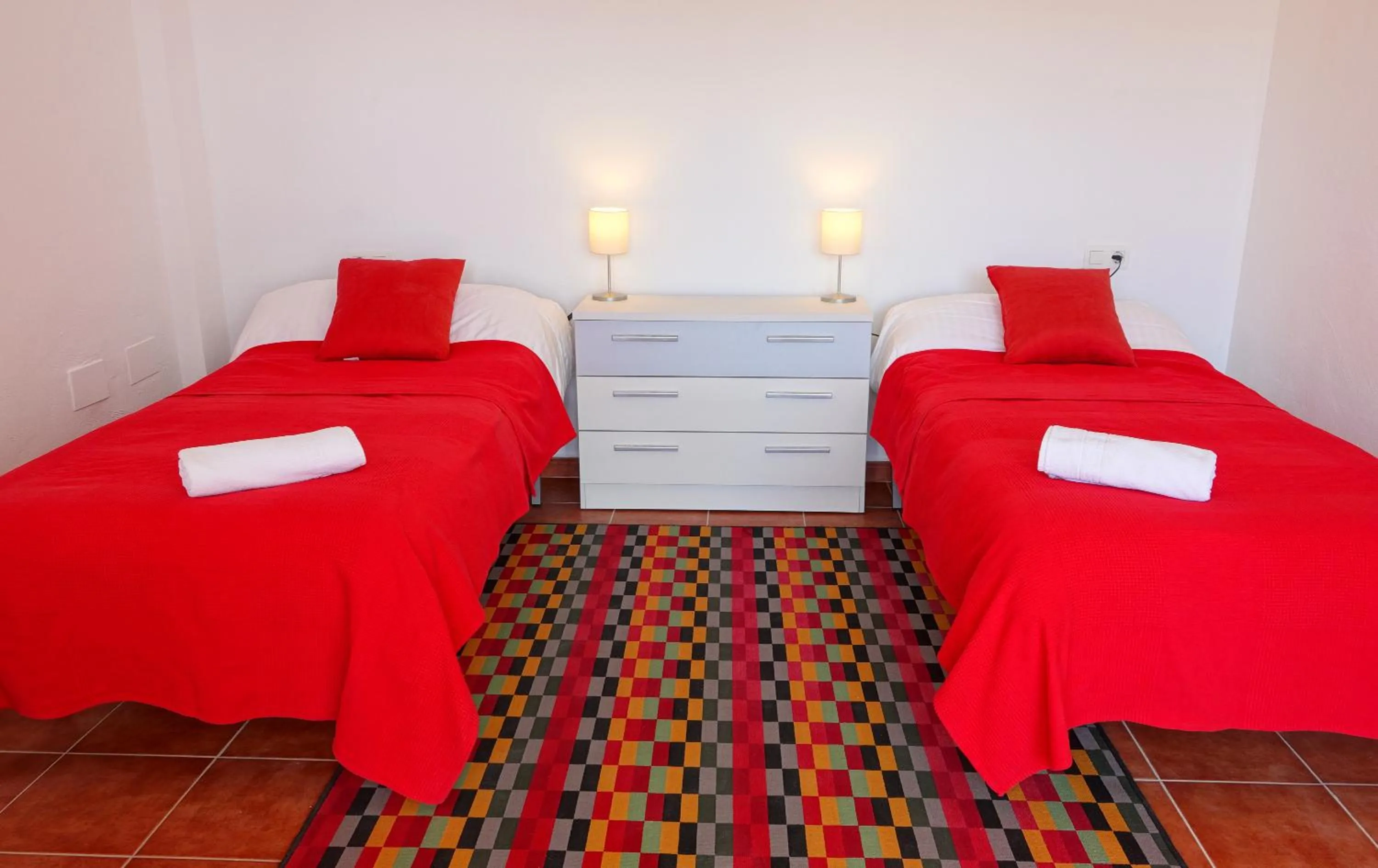 Bed in Casa Arts guest rooms