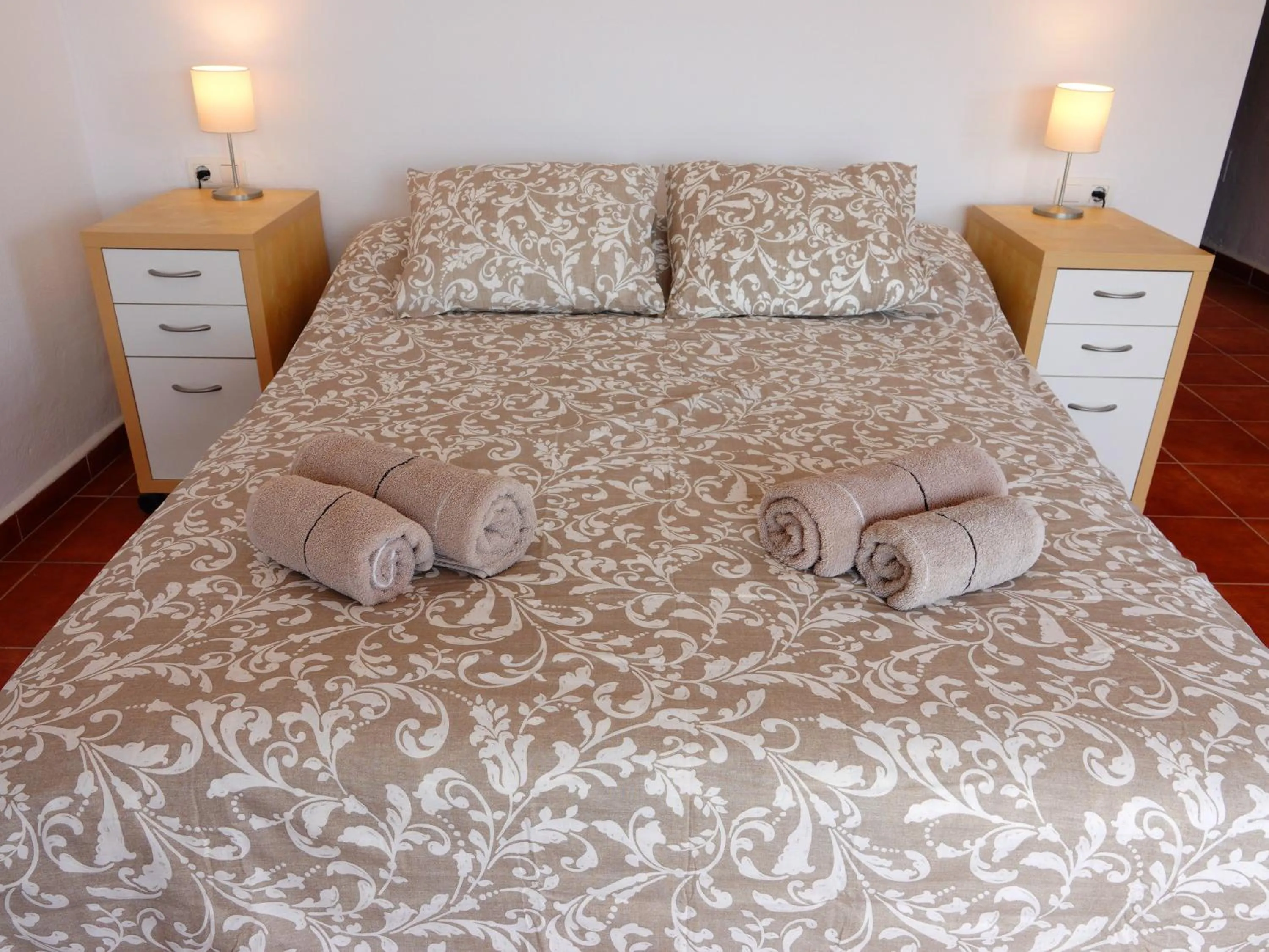 Bed in Casa Arts guest rooms