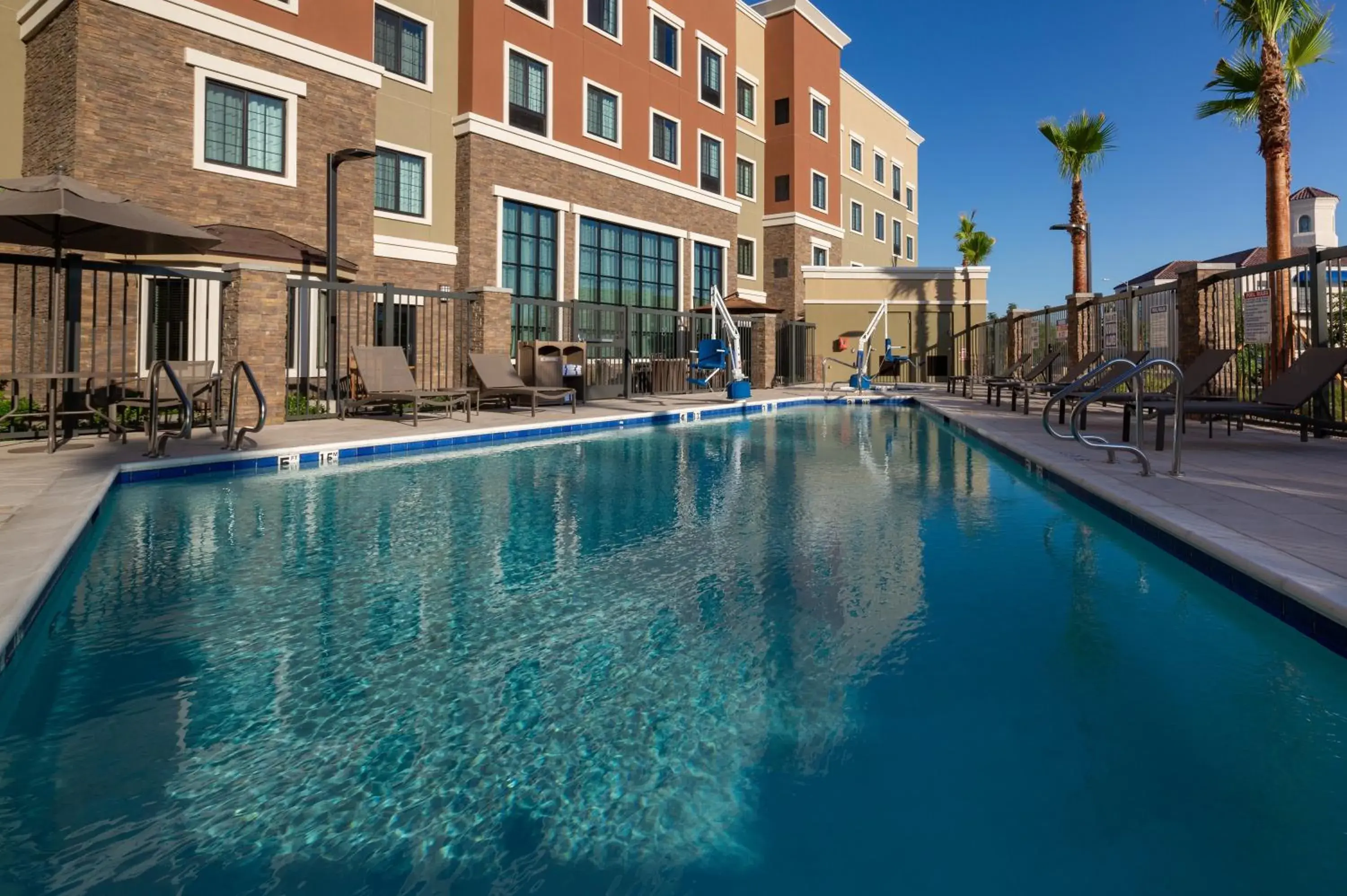 Swimming pool in Staybridge Suites - Phoenix – Biltmore Area by IHG Swimming pool in Staybridge Suites - Phoenix – Biltmore Area by IHG
