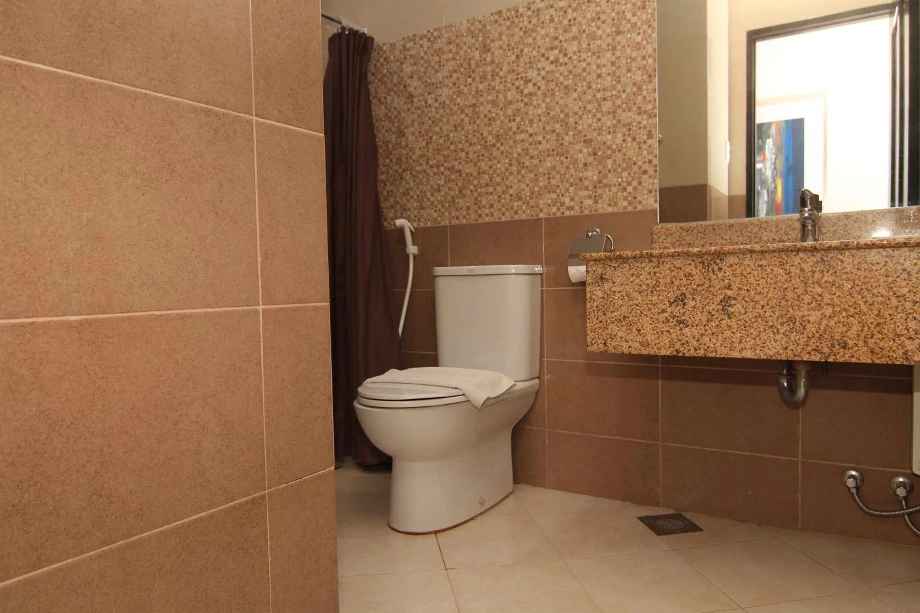Toilet in Main Hotel & Suites