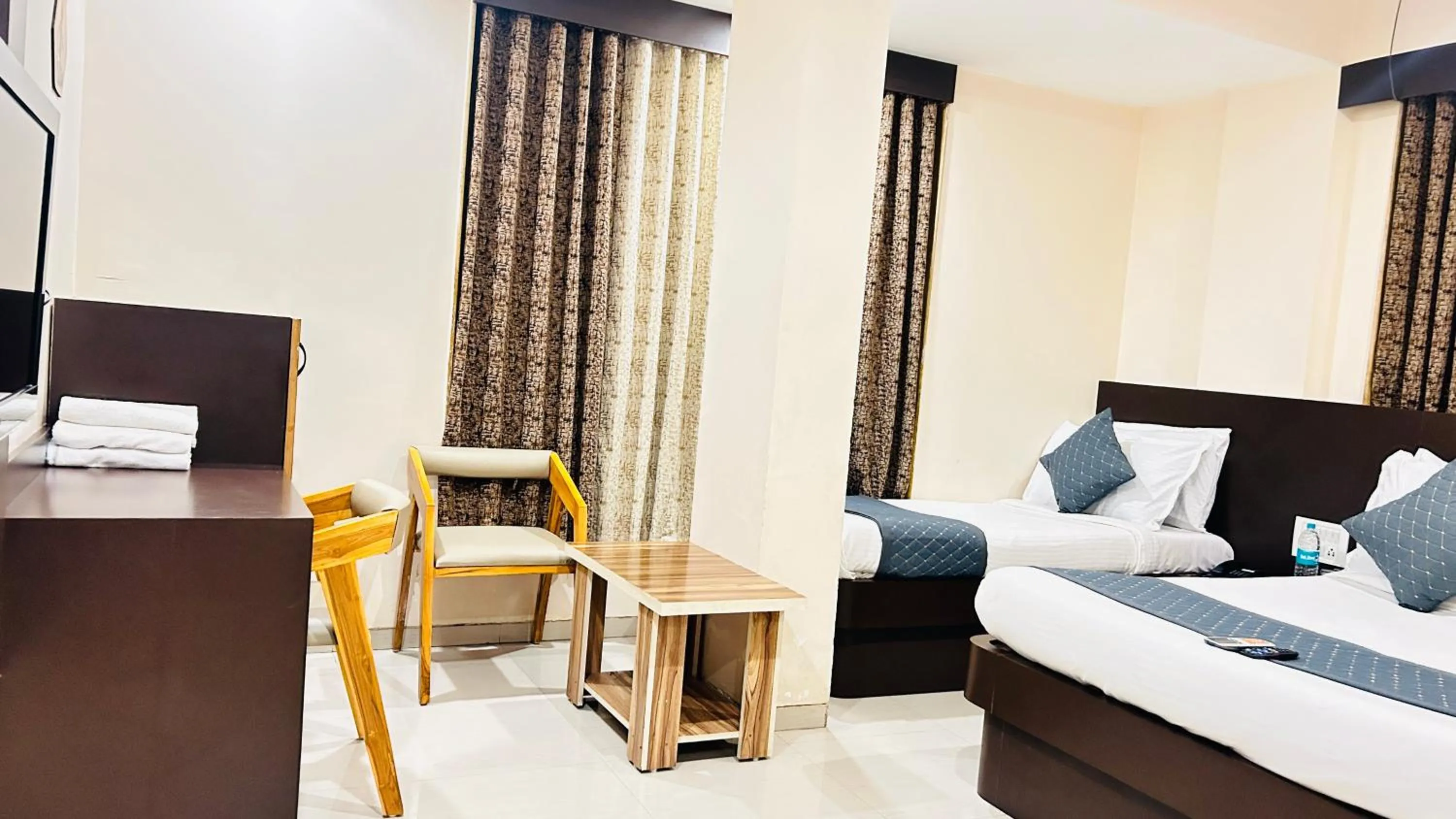 Seating area, Bed in Hotel Krishna Sai Kutir