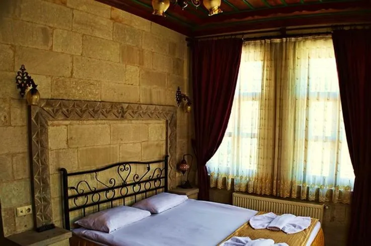 Photo of the whole room, Bed in Cappadocia Stone Palace