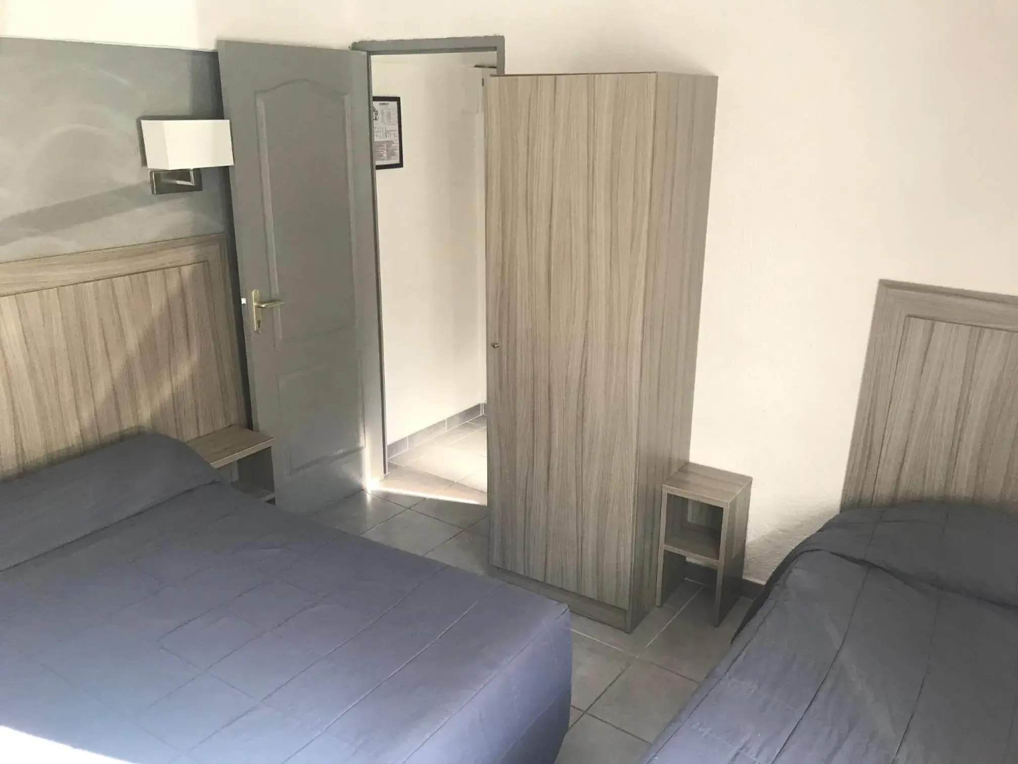 Economy Triple Room in Hotel Les Palmiers En Camargue Economy Triple Room in Hotel Les Palmiers En Camargue