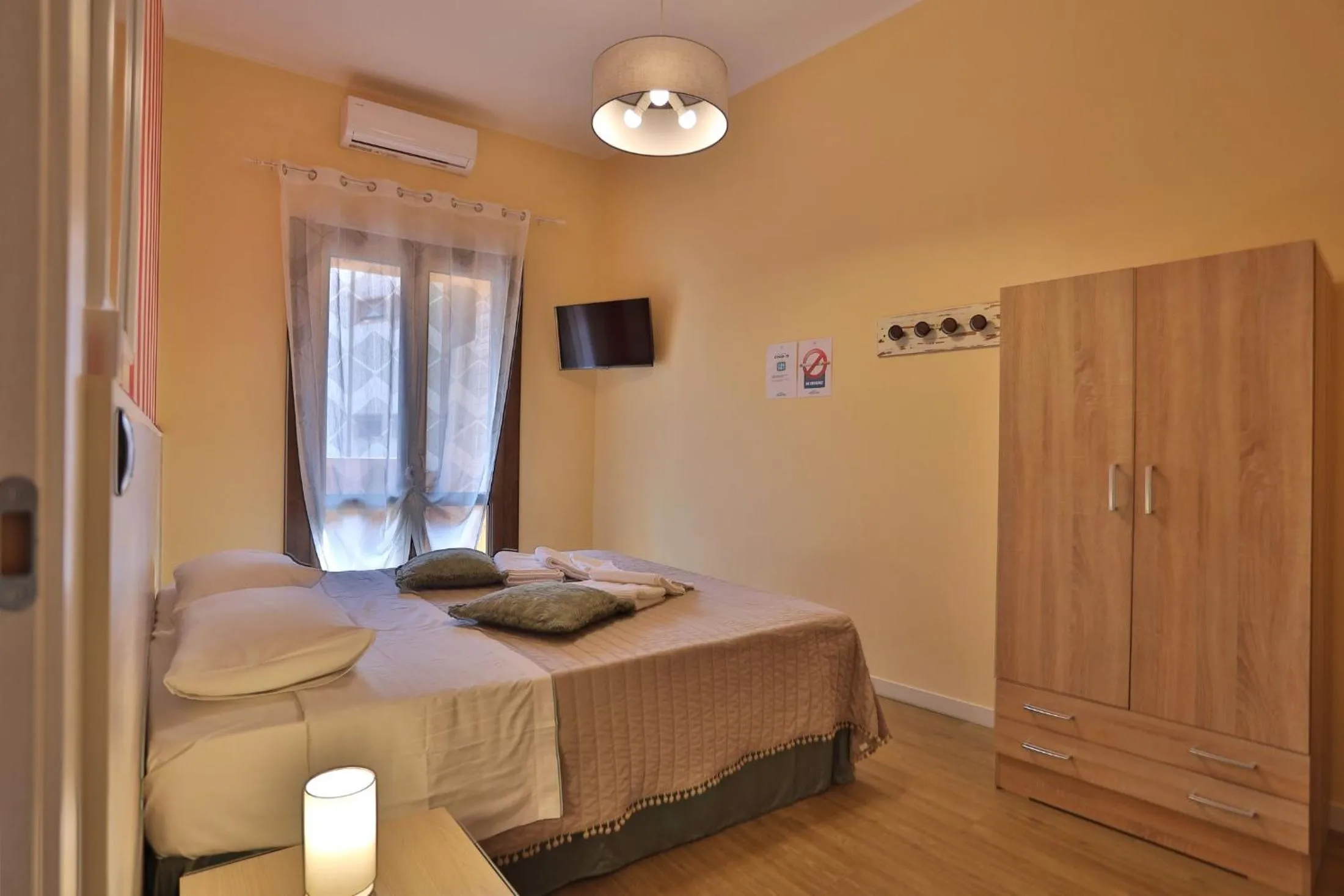 Bed in L'OPERA ROOMS