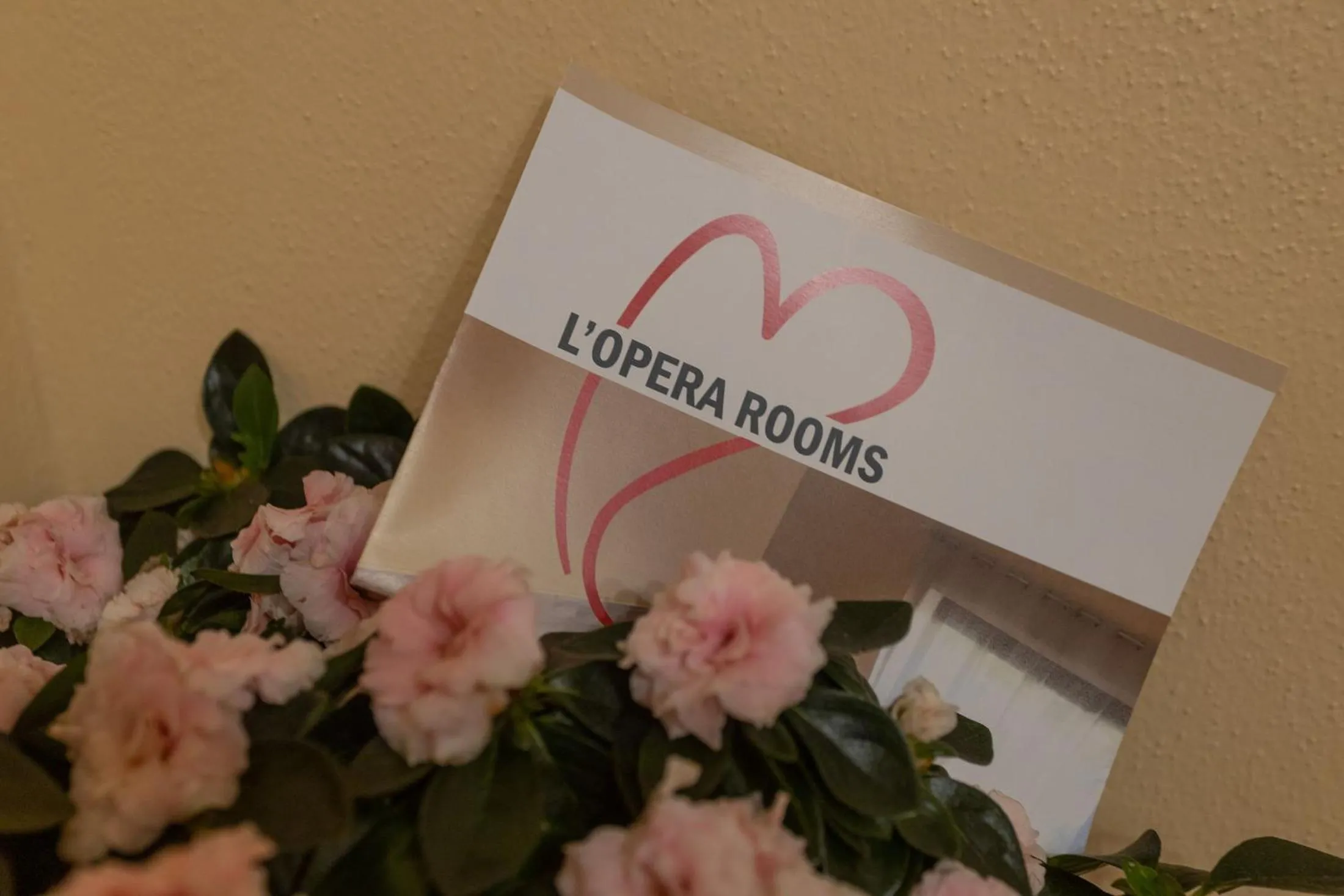 Property logo or sign in L'OPERA ROOMS