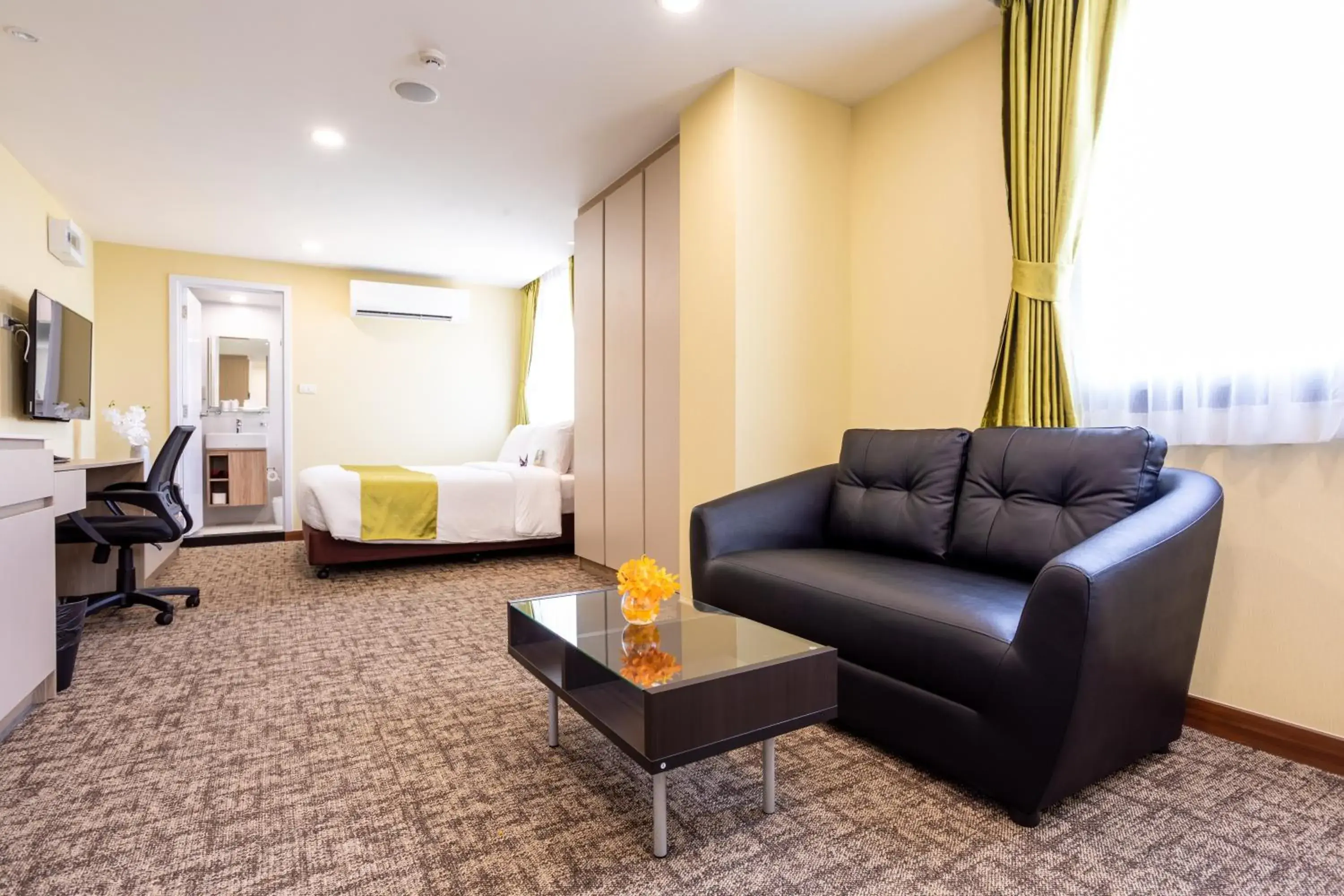 Seating area, Bed in Hotel Kuretakeso Thailand Sriracha - SHA Extra Plus Seating area, Bed in Hotel Kuretakeso Thailand Sriracha - SHA Extra Plus