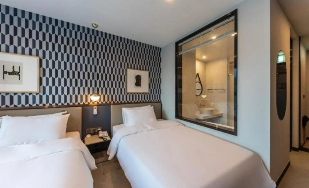 Bed in Brown Dot Hotel Deokcheon