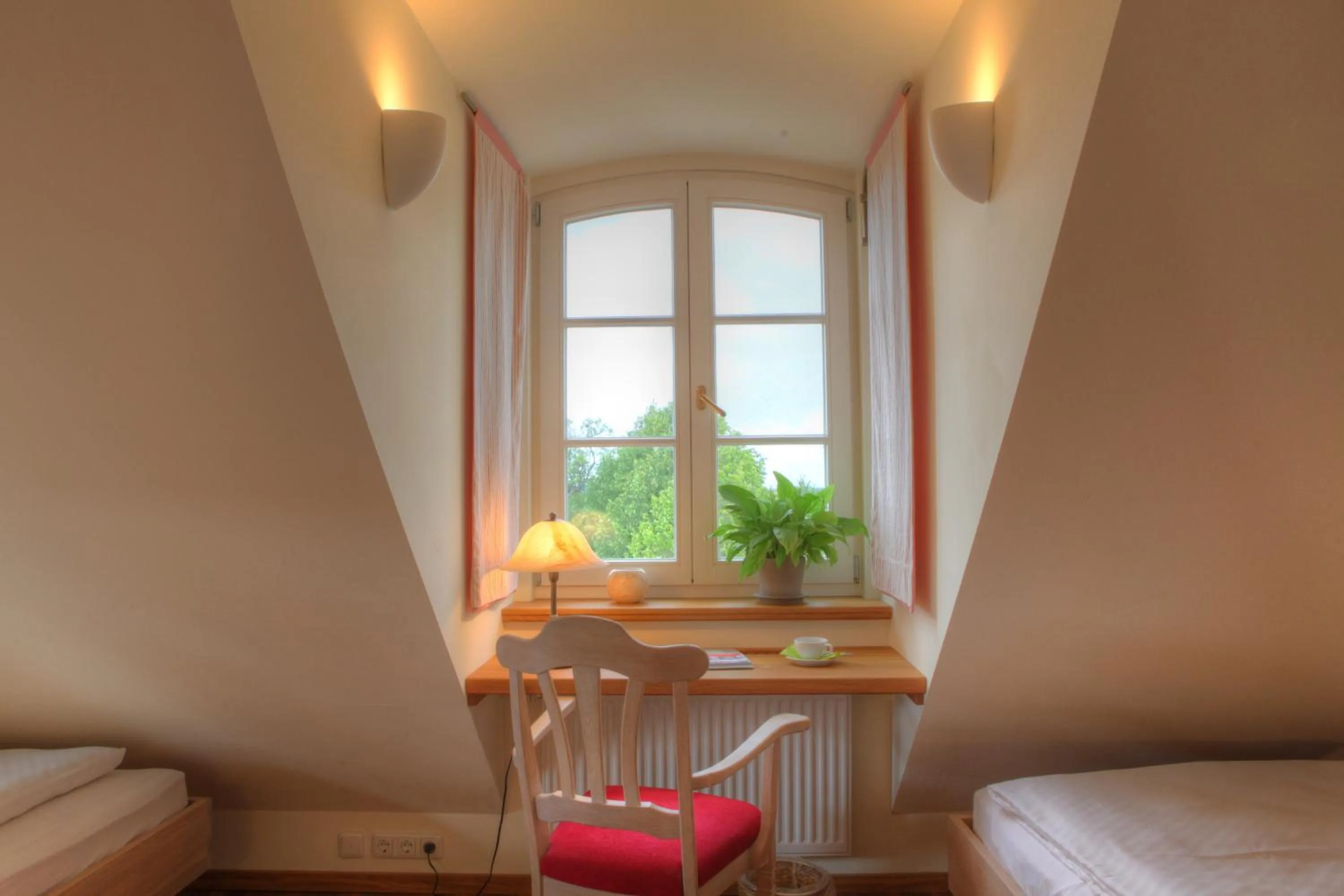 Seating area, Bed in Hotel Gutshaus Parin - Bio- und Gesundheitshotel