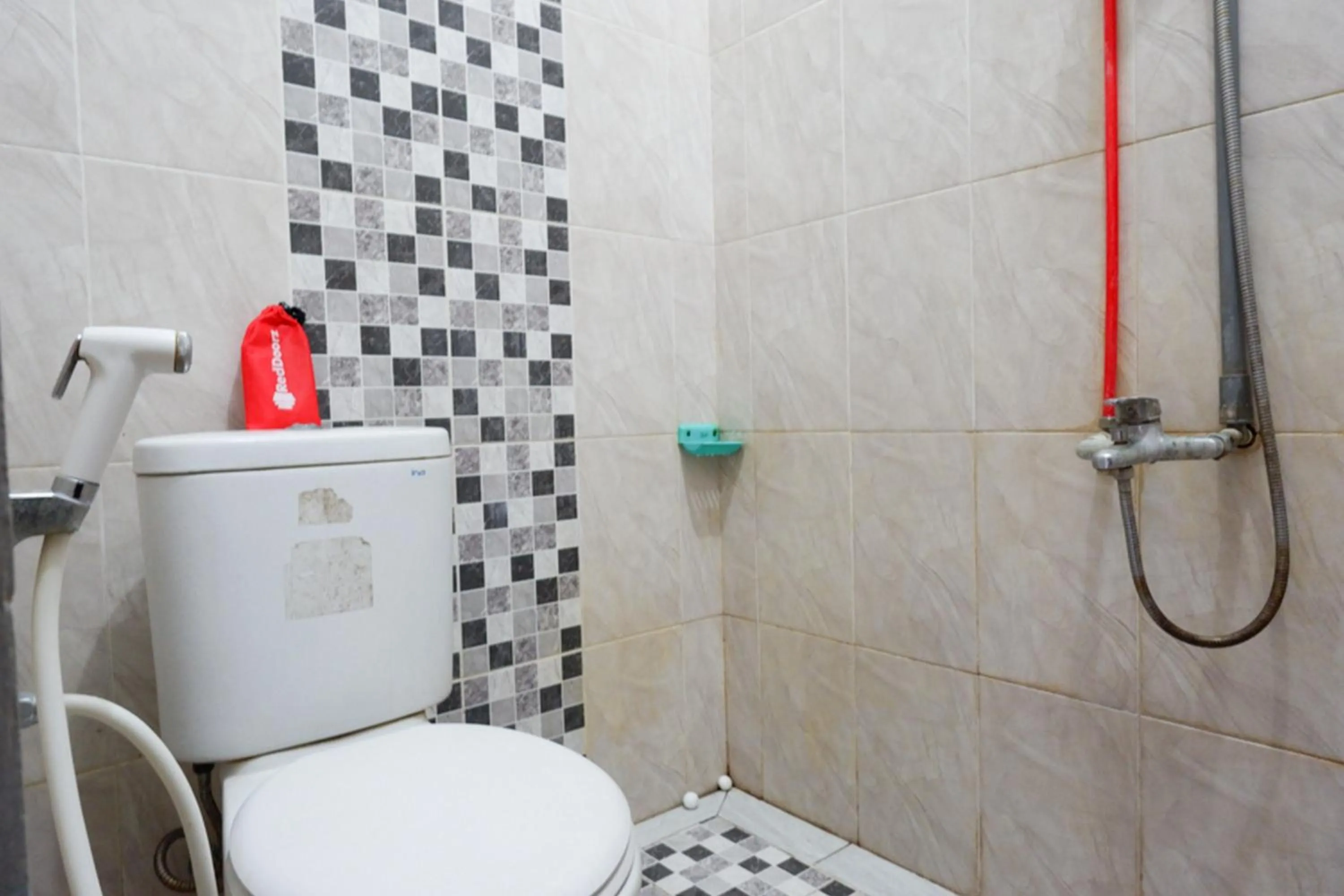 Bathroom in RedDoorz Syariah near Menara Kudus