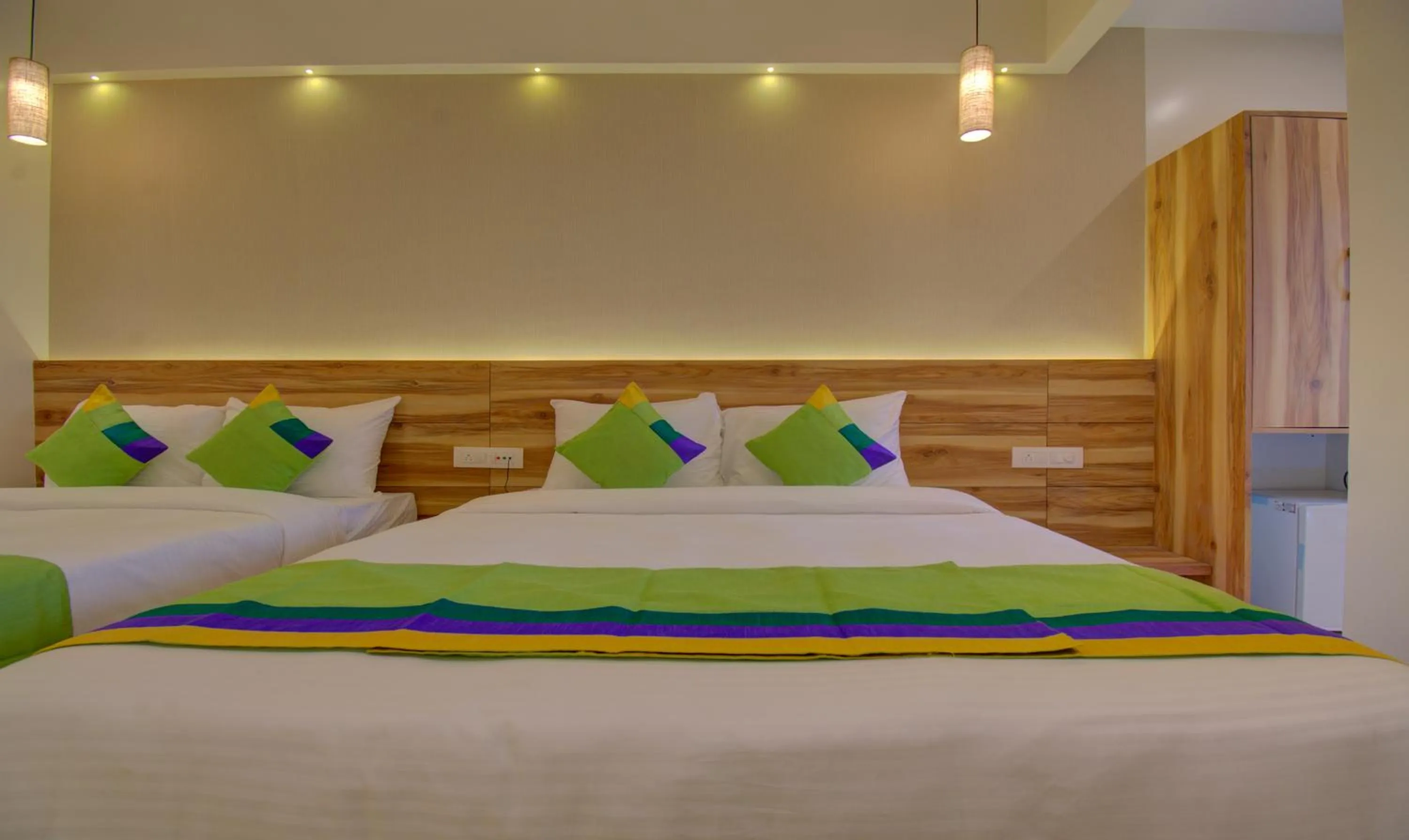 Bed in Hotel Amisha International