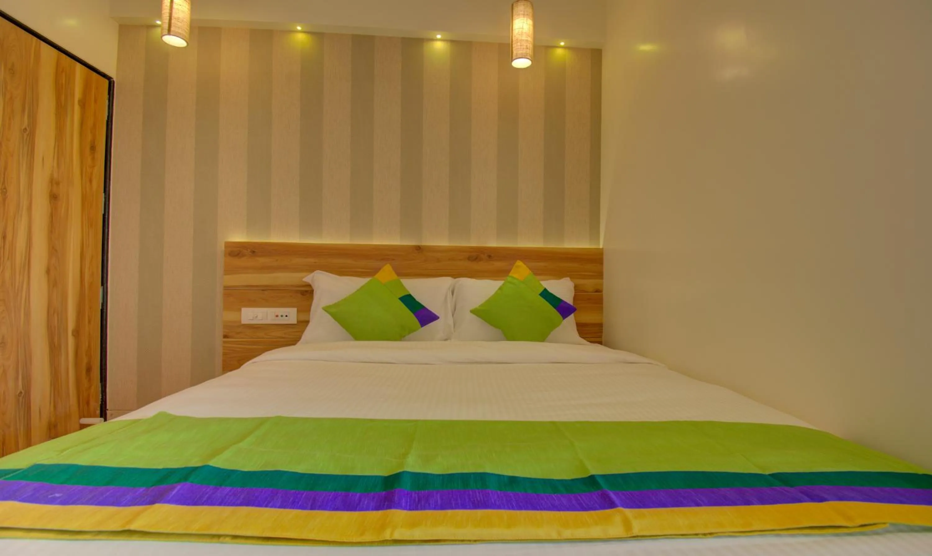 Bed in Hotel Amisha International