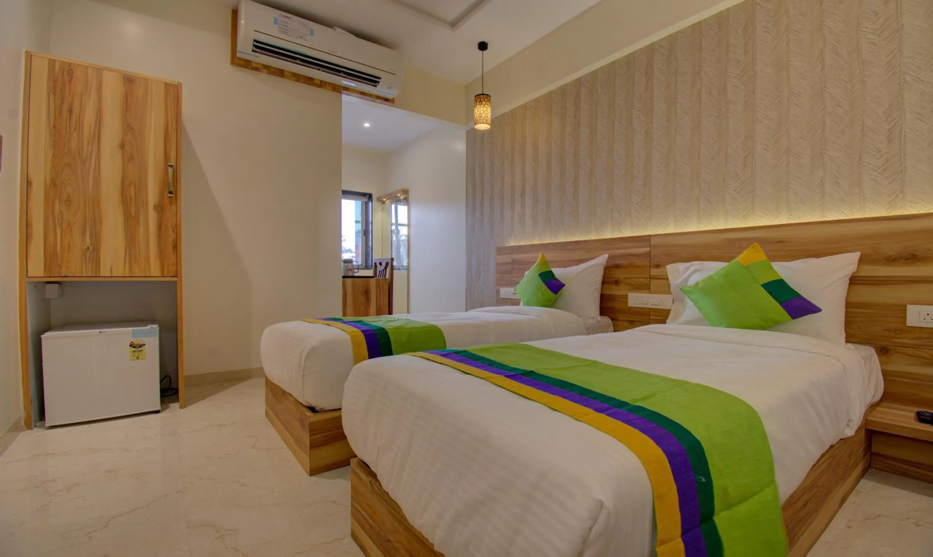 Bed in Hotel Amisha International