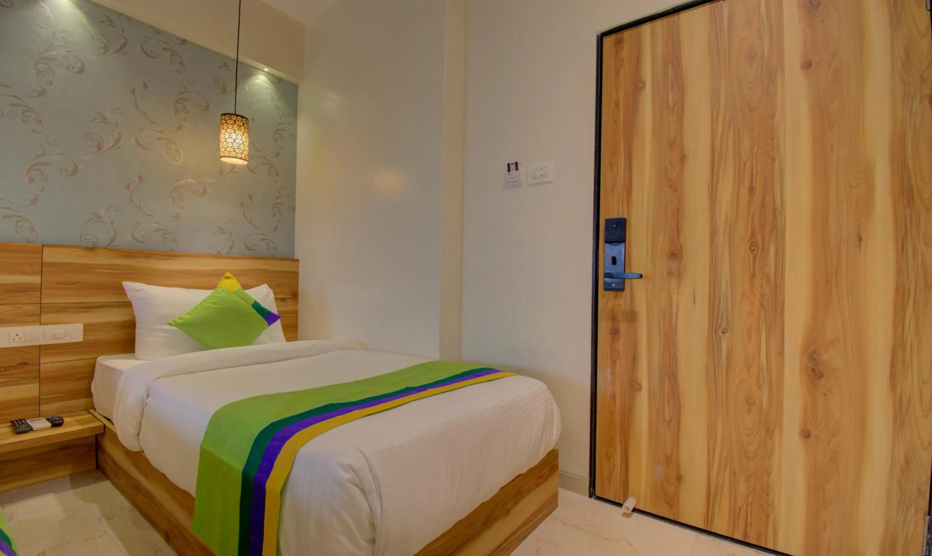 Bed in Hotel Amisha International