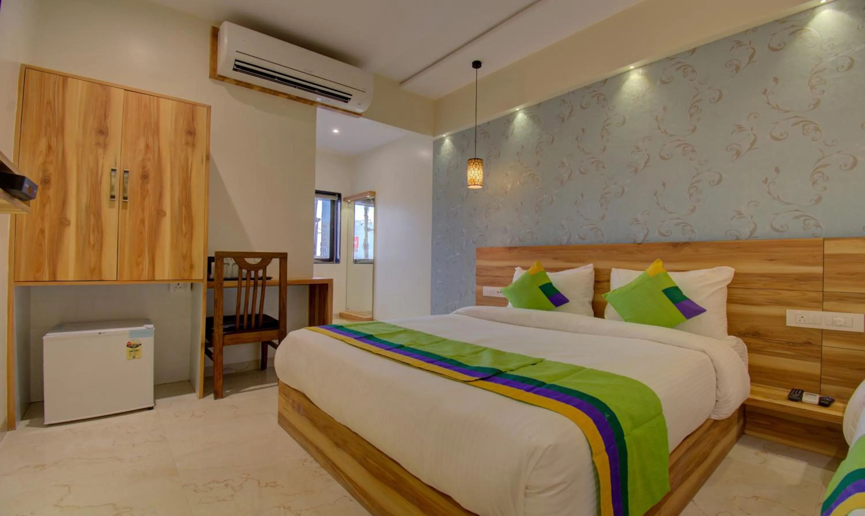 Bed in Hotel Amisha International