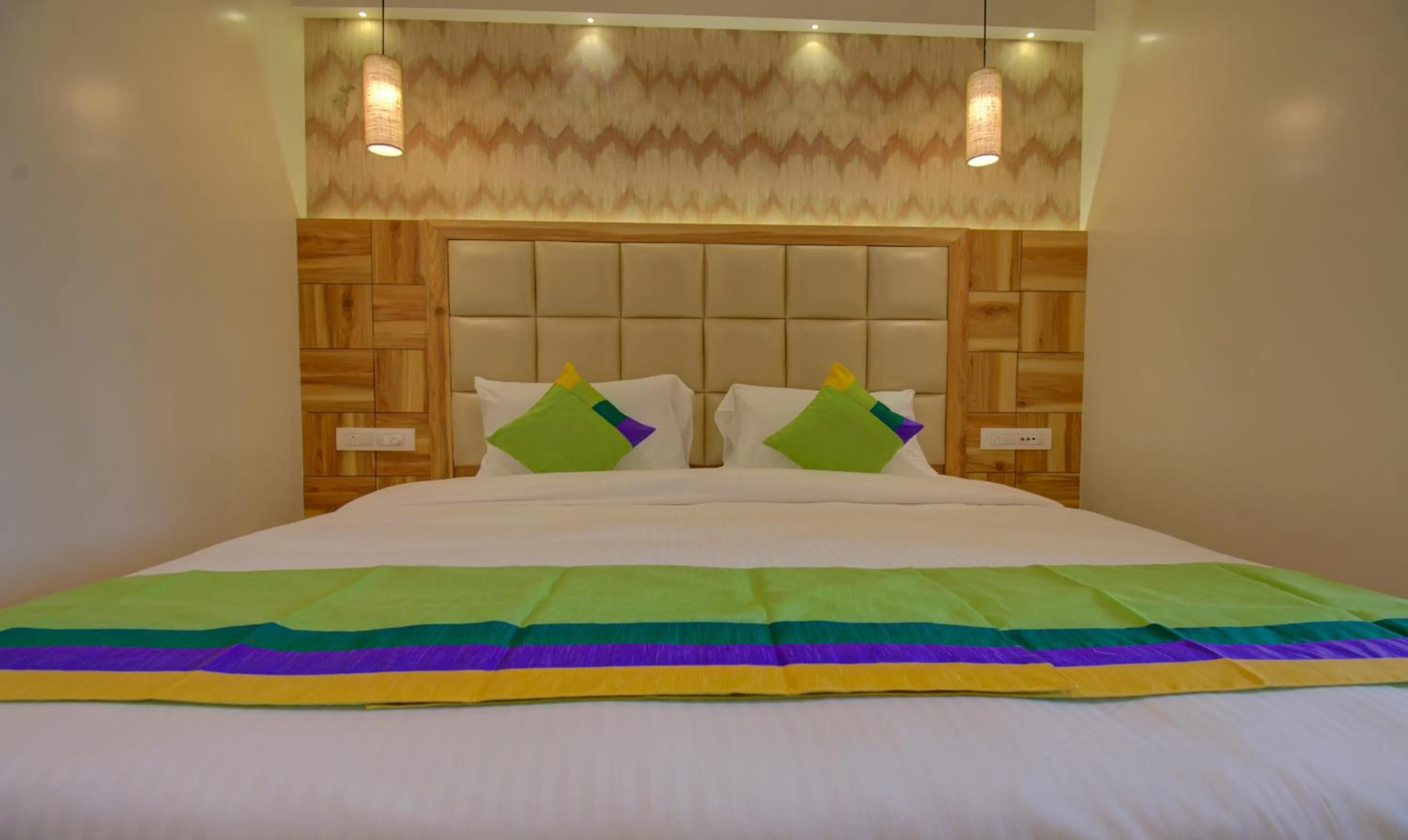 Bed in Hotel Amisha International