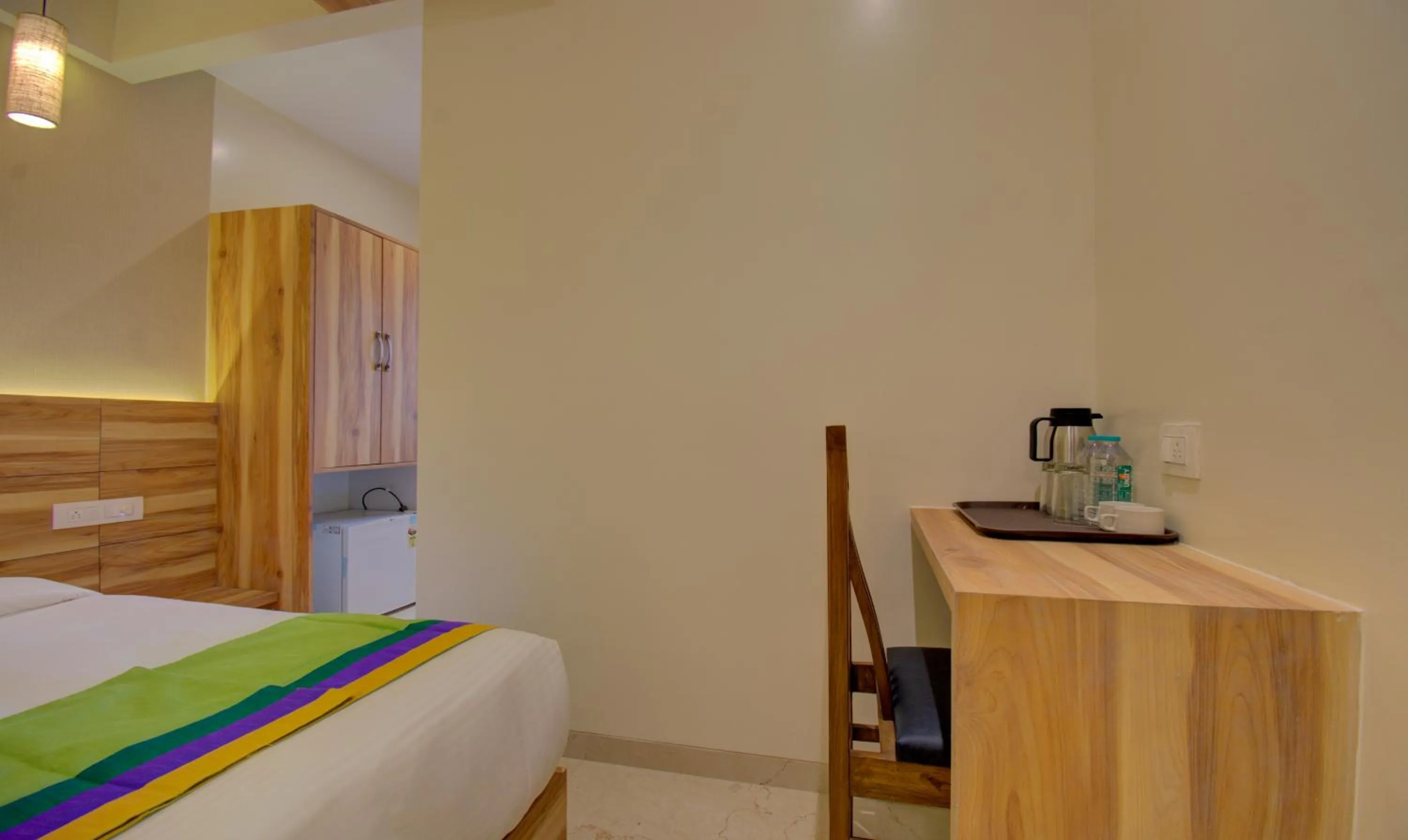 Bed in Hotel Amisha International