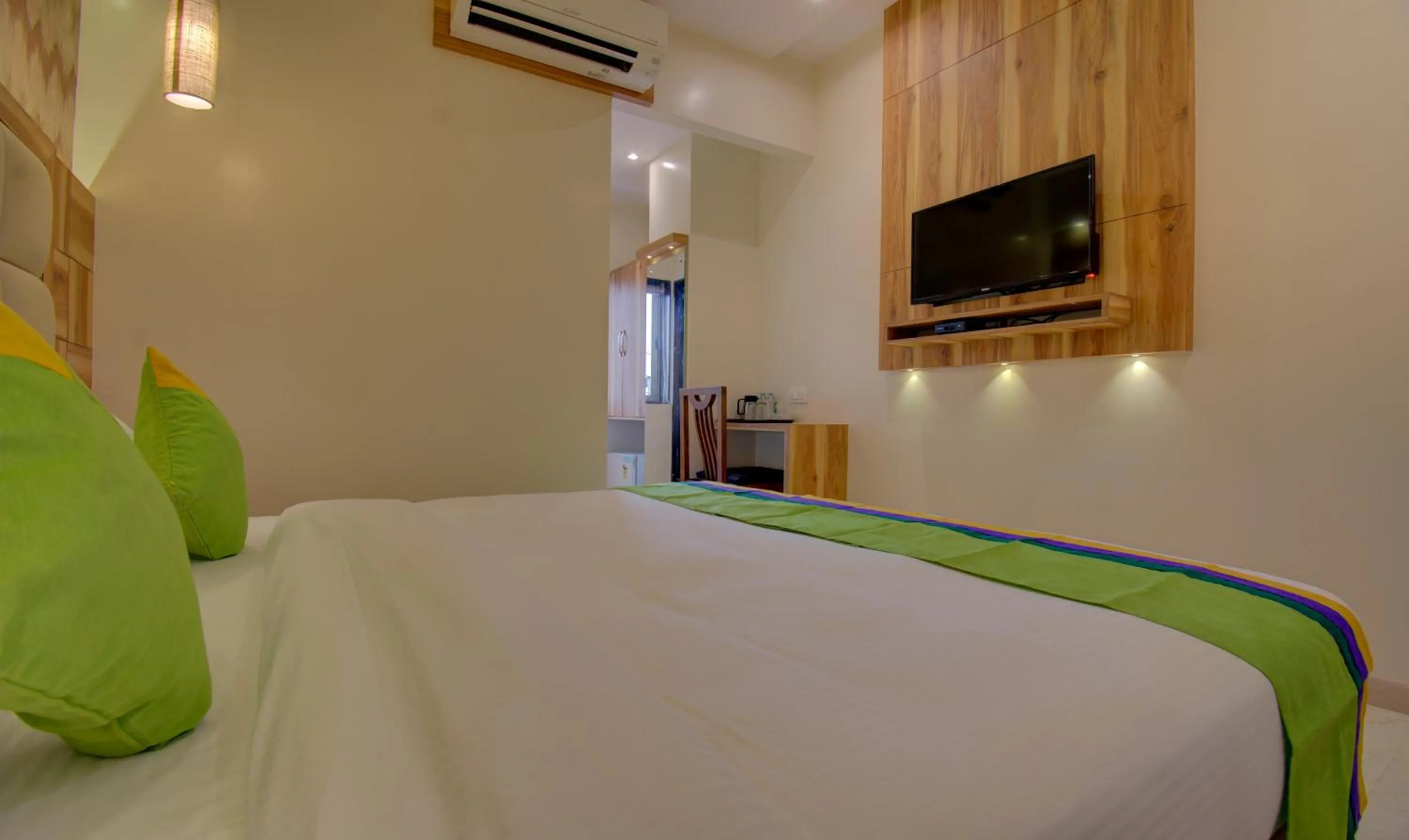 Bed in Hotel Amisha International