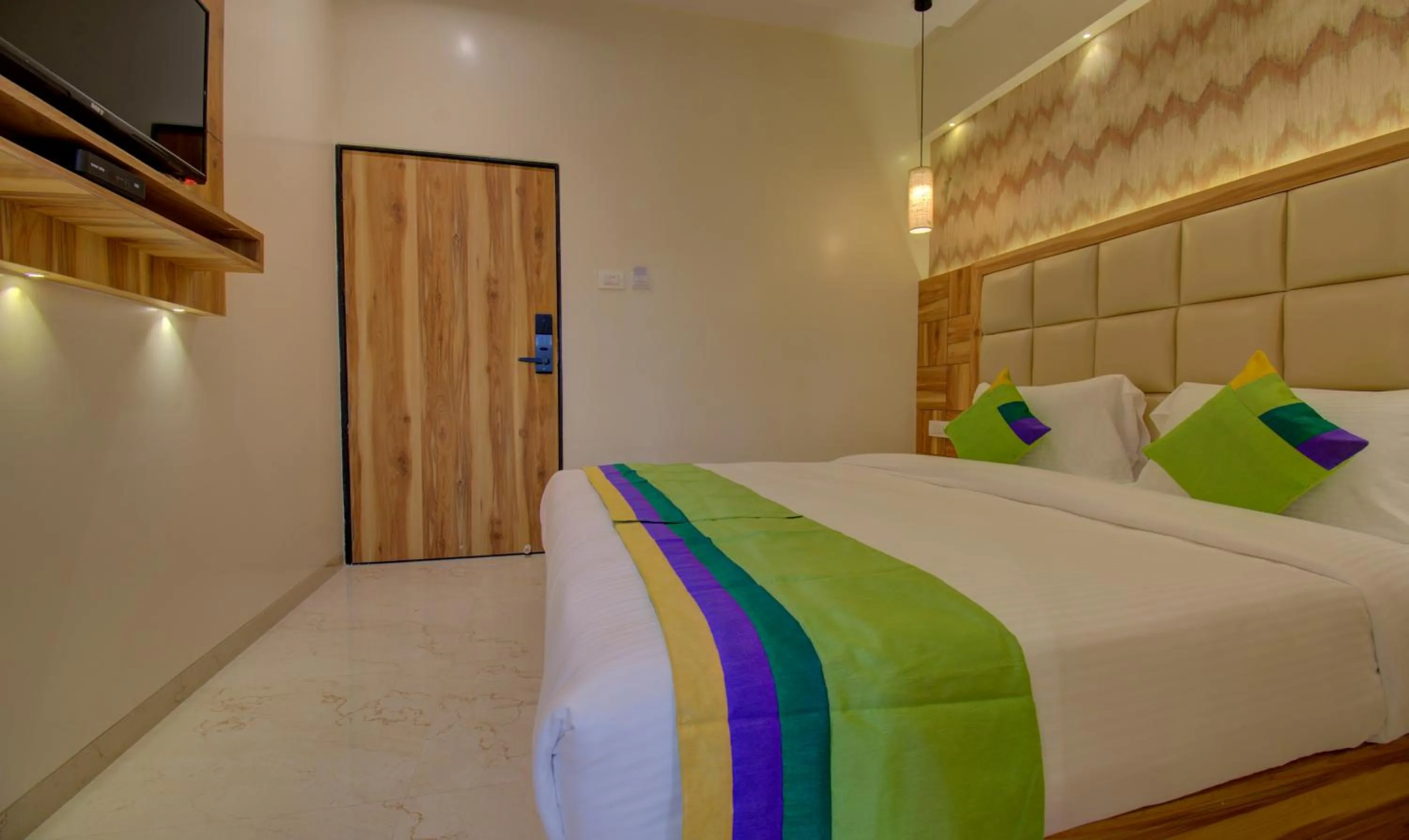 Bed in Hotel Amisha International