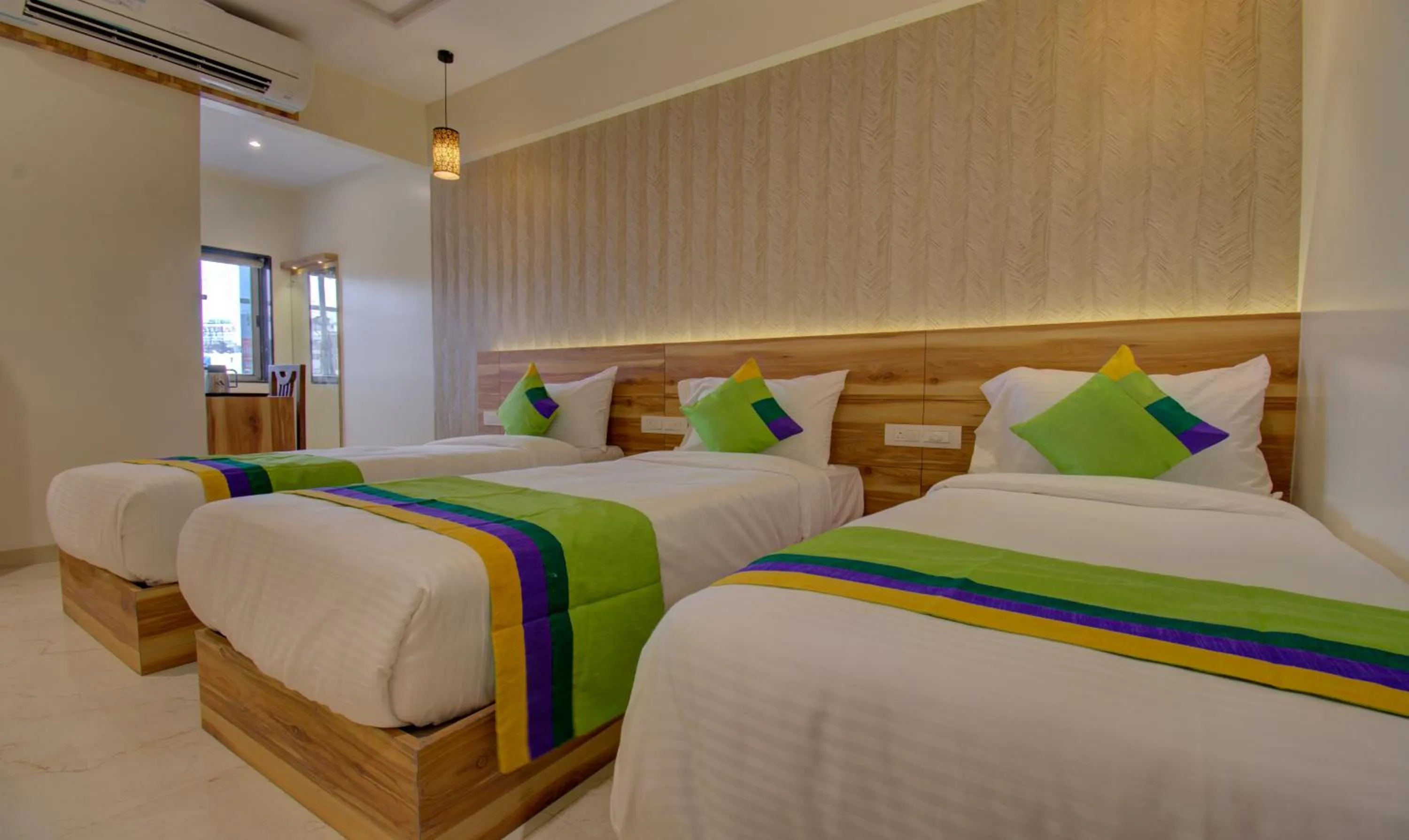 Bed in Hotel Amisha International