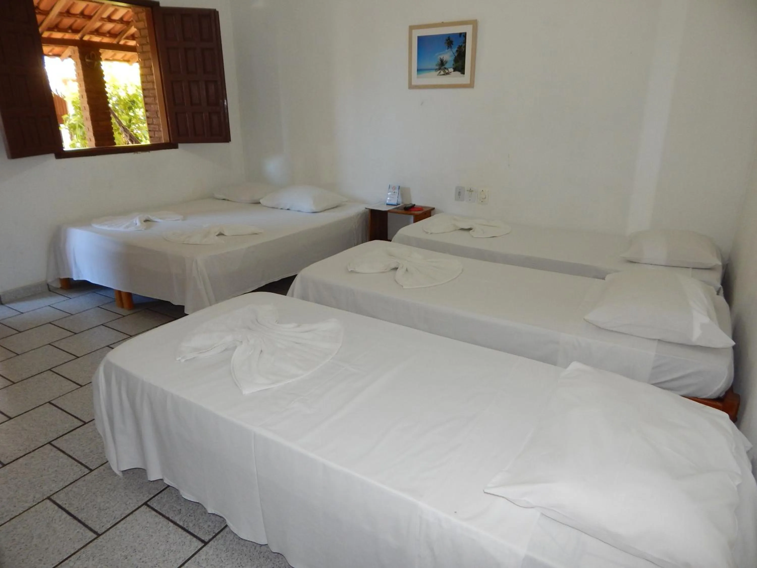 Bed in Pousada Água de Côco