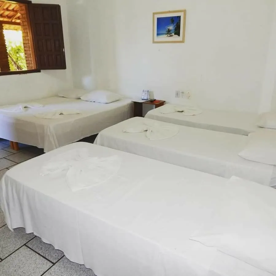 Bed in Pousada Água de Côco
