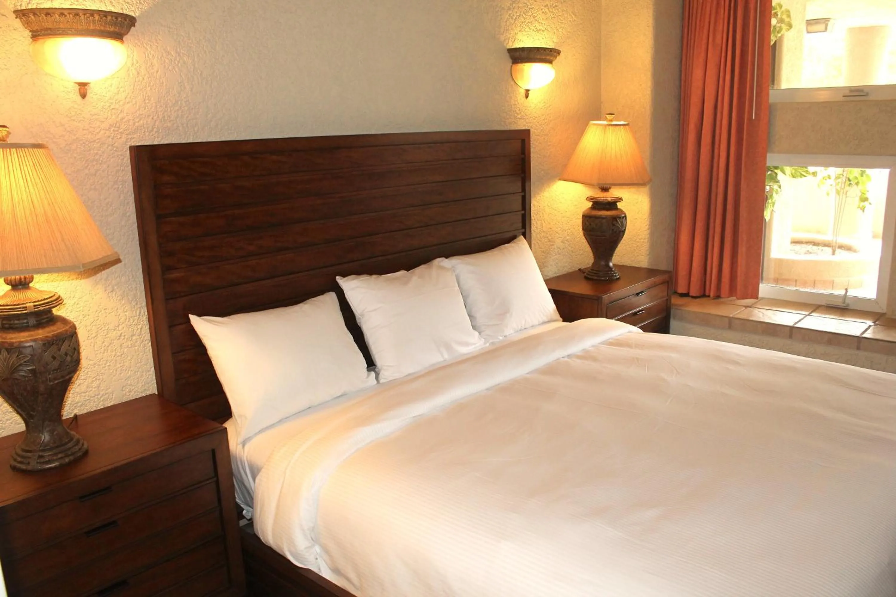 Bed in Mayan Princess Beach & Dive Resort