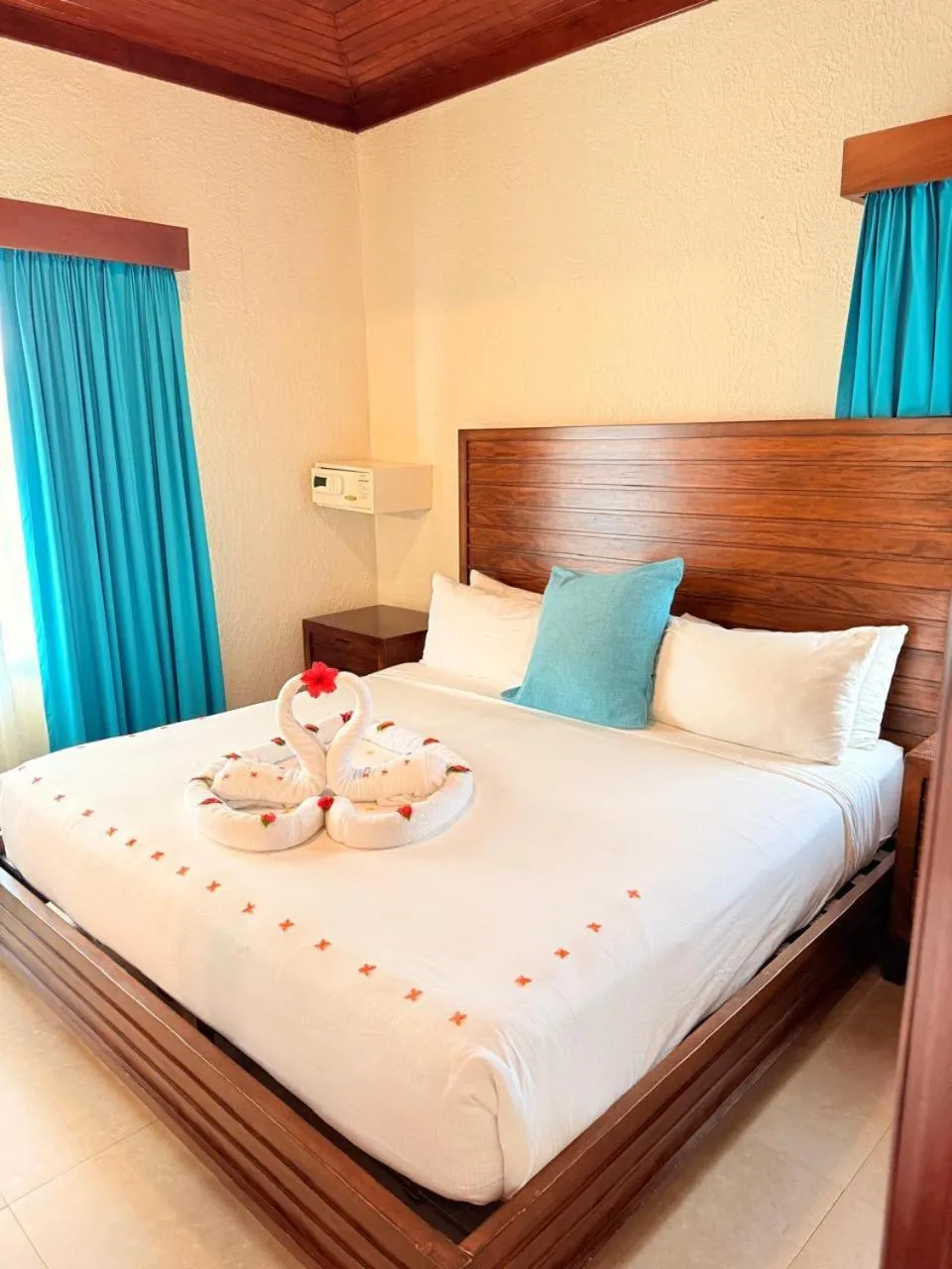 Bed in Mayan Princess Beach & Dive Resort