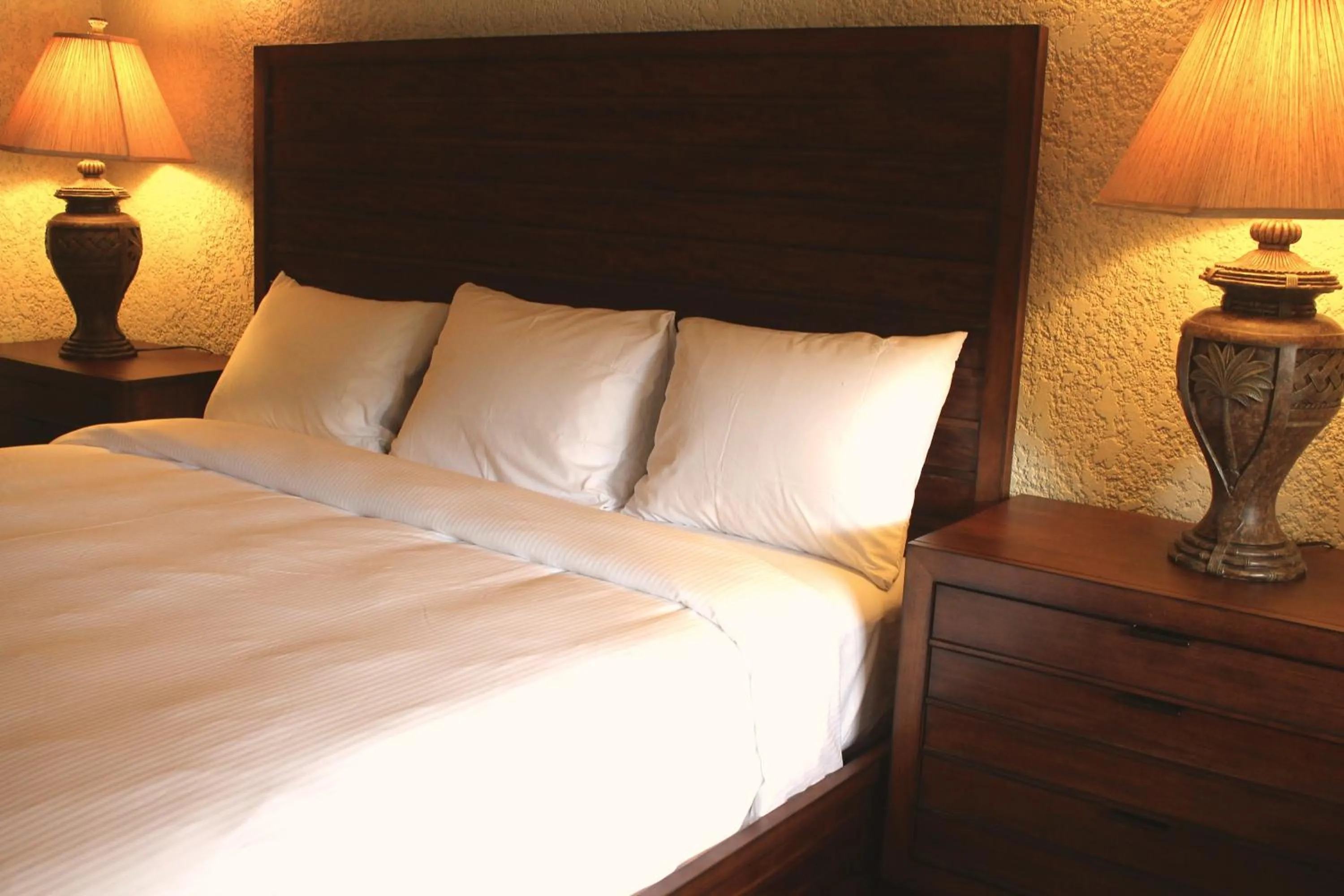 Bed in Mayan Princess Beach & Dive Resort