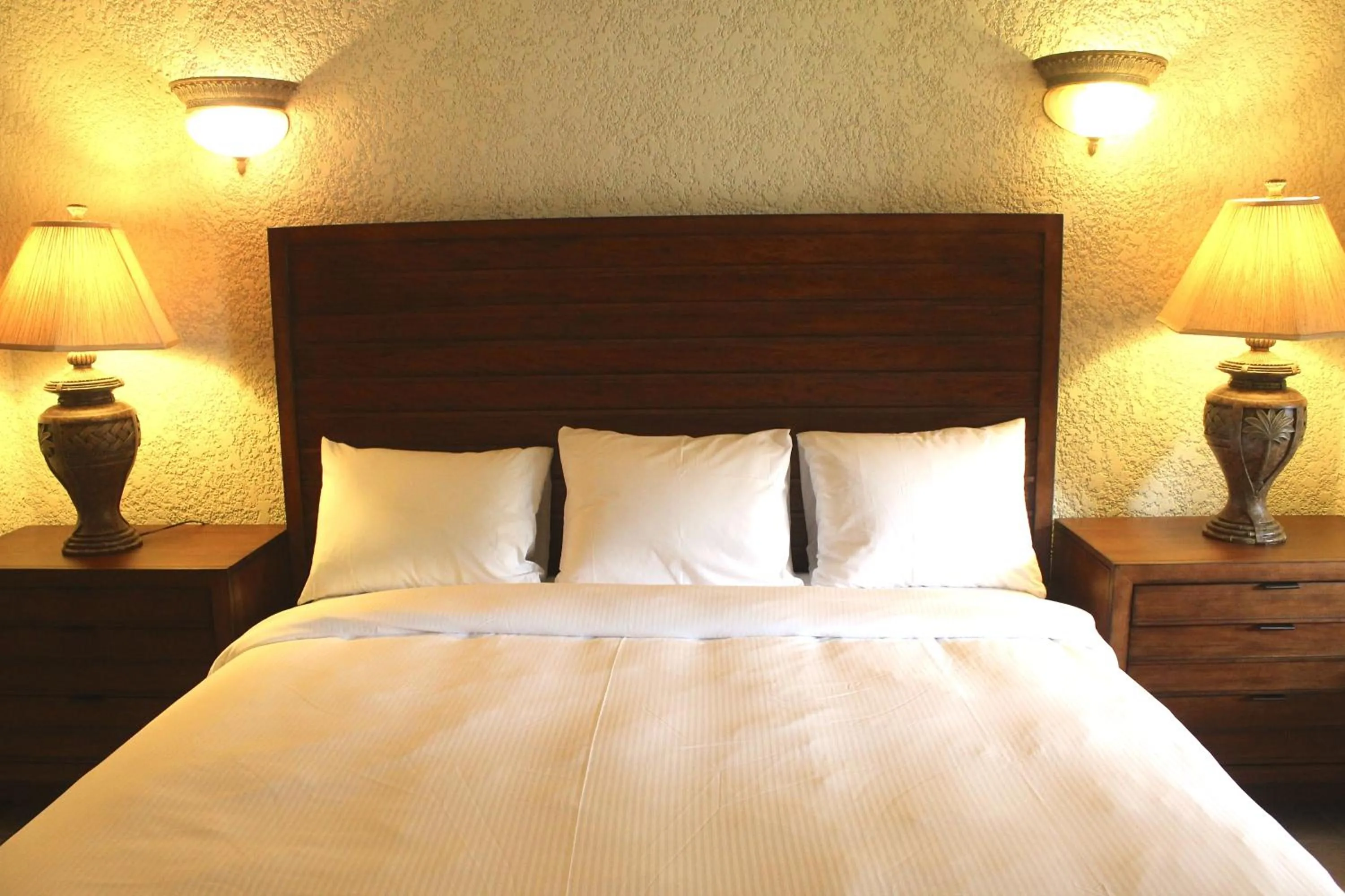 Bed in Mayan Princess Beach & Dive Resort