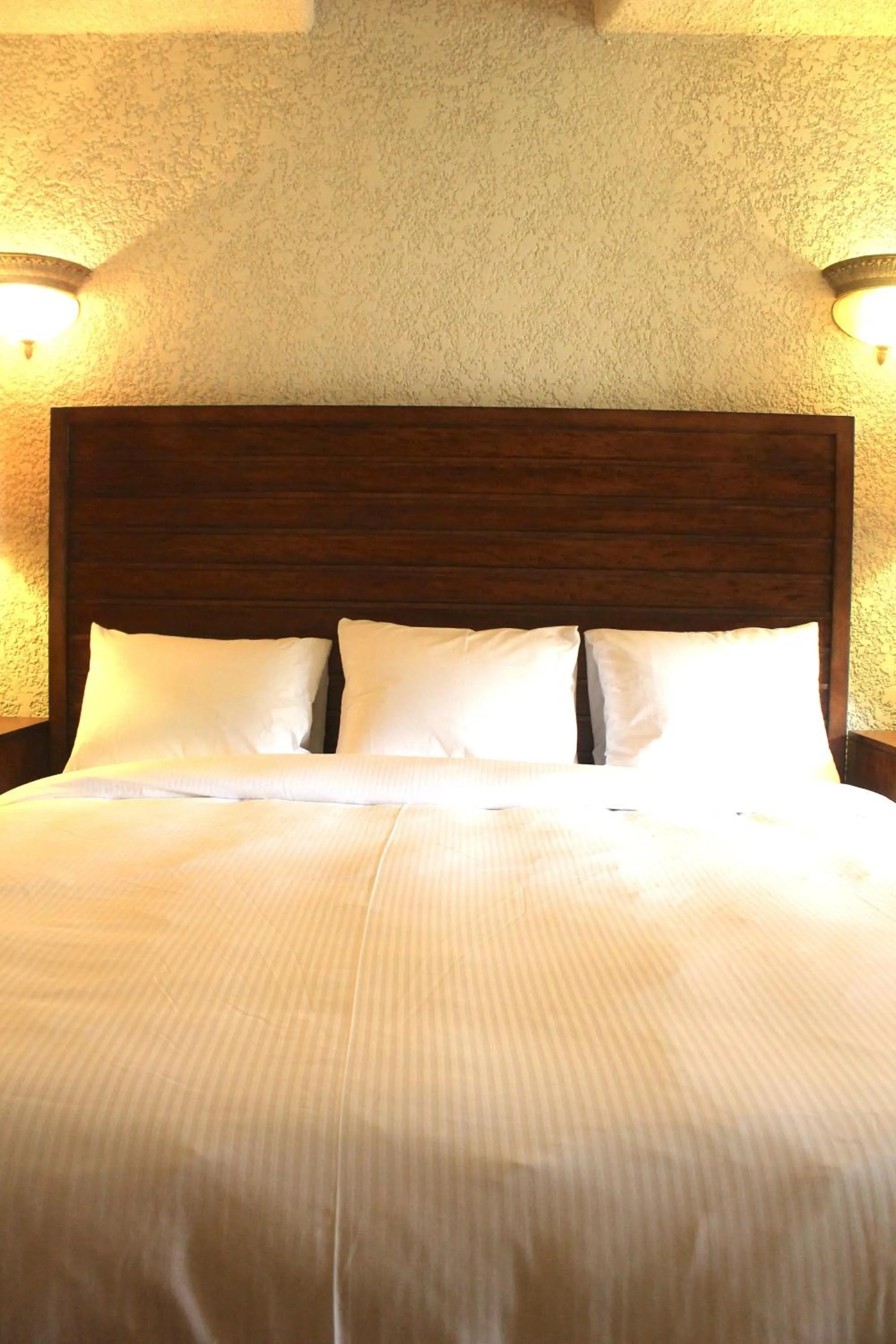 Bed in Mayan Princess Beach & Dive Resort