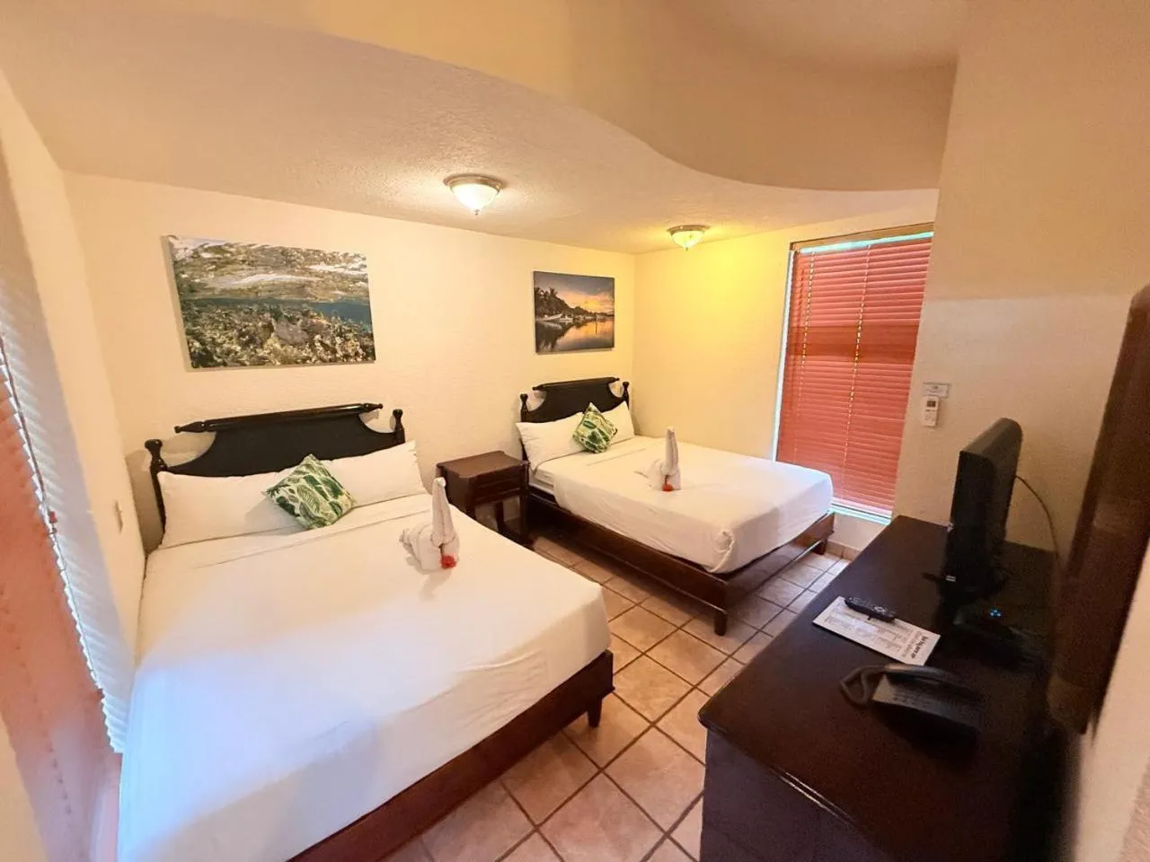 Bed in Mayan Princess Beach & Dive Resort