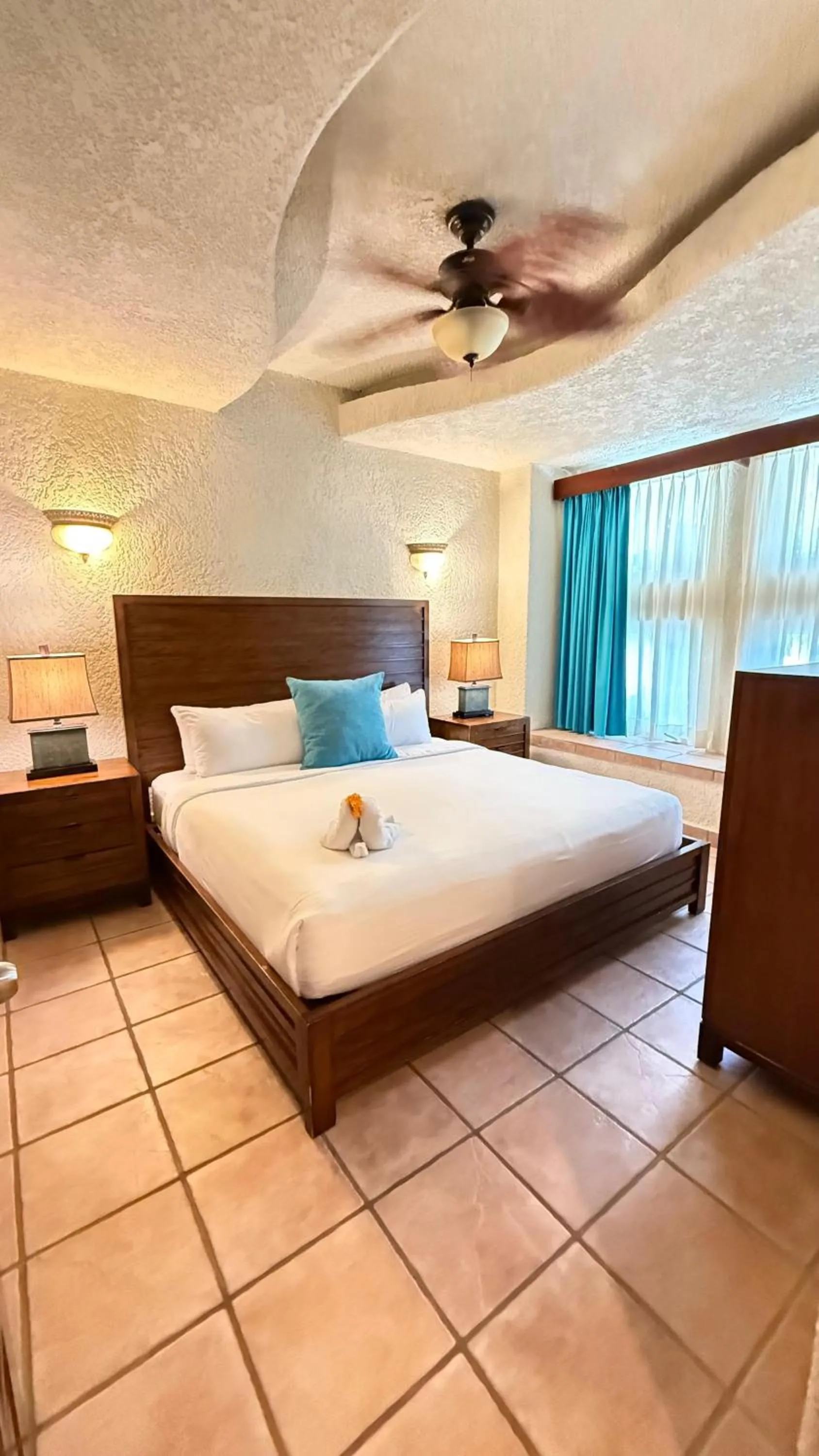 Bed in Mayan Princess Beach & Dive Resort
