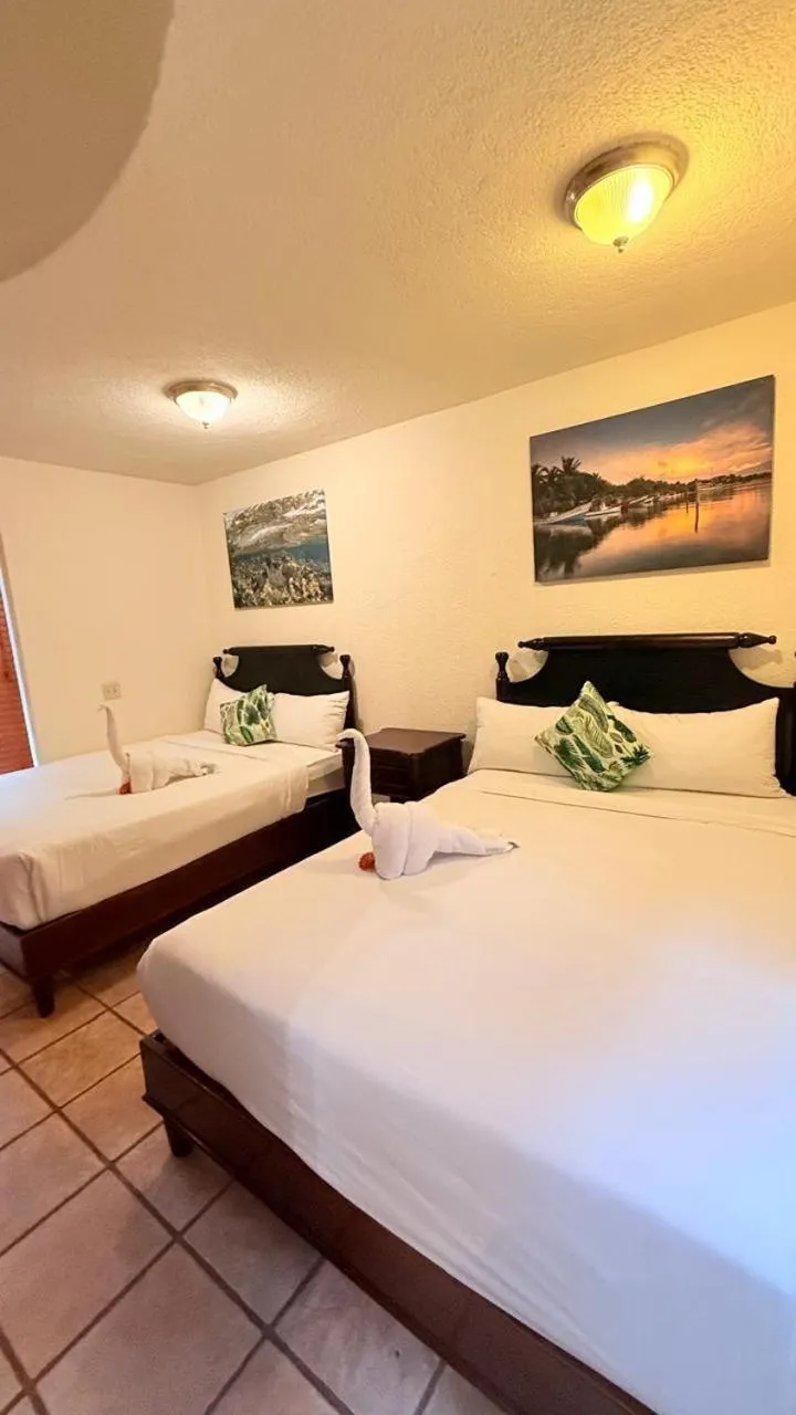 Bed in Mayan Princess Beach & Dive Resort