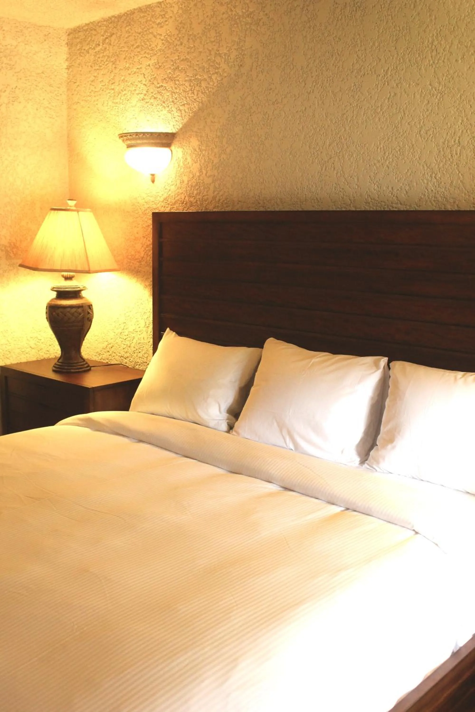 Bed in Mayan Princess Beach & Dive Resort