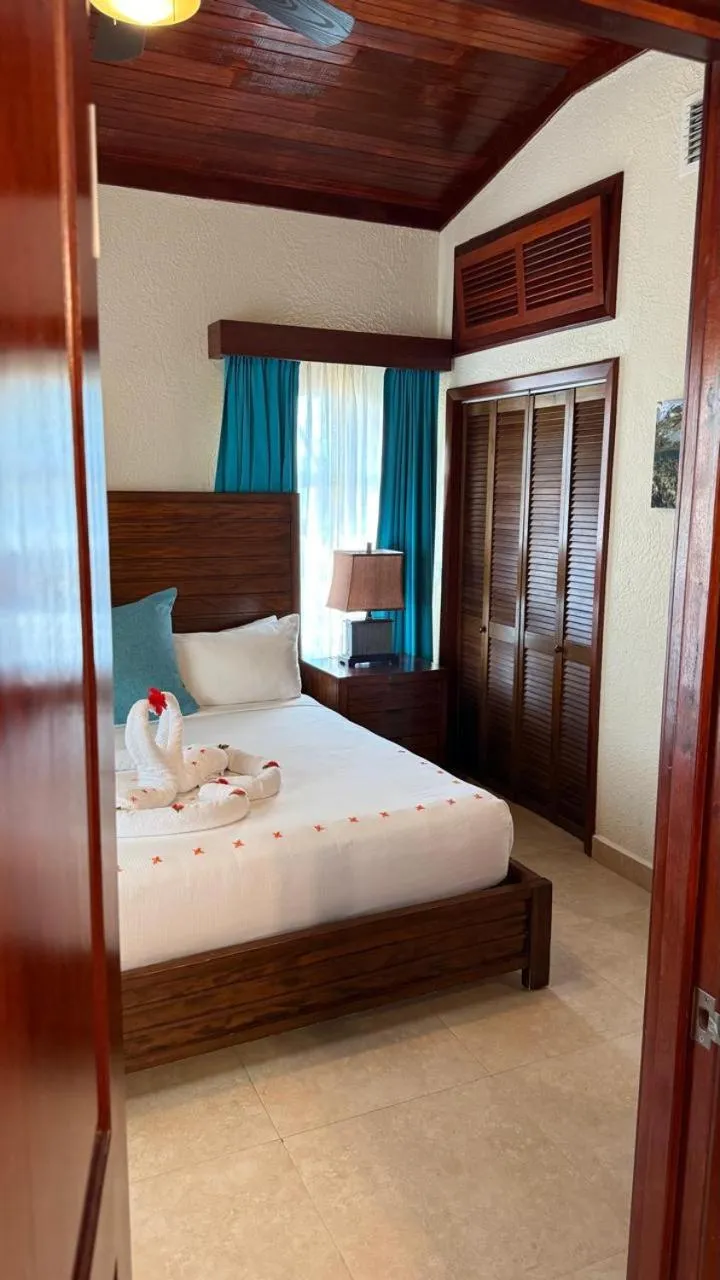 Bed in Mayan Princess Beach & Dive Resort