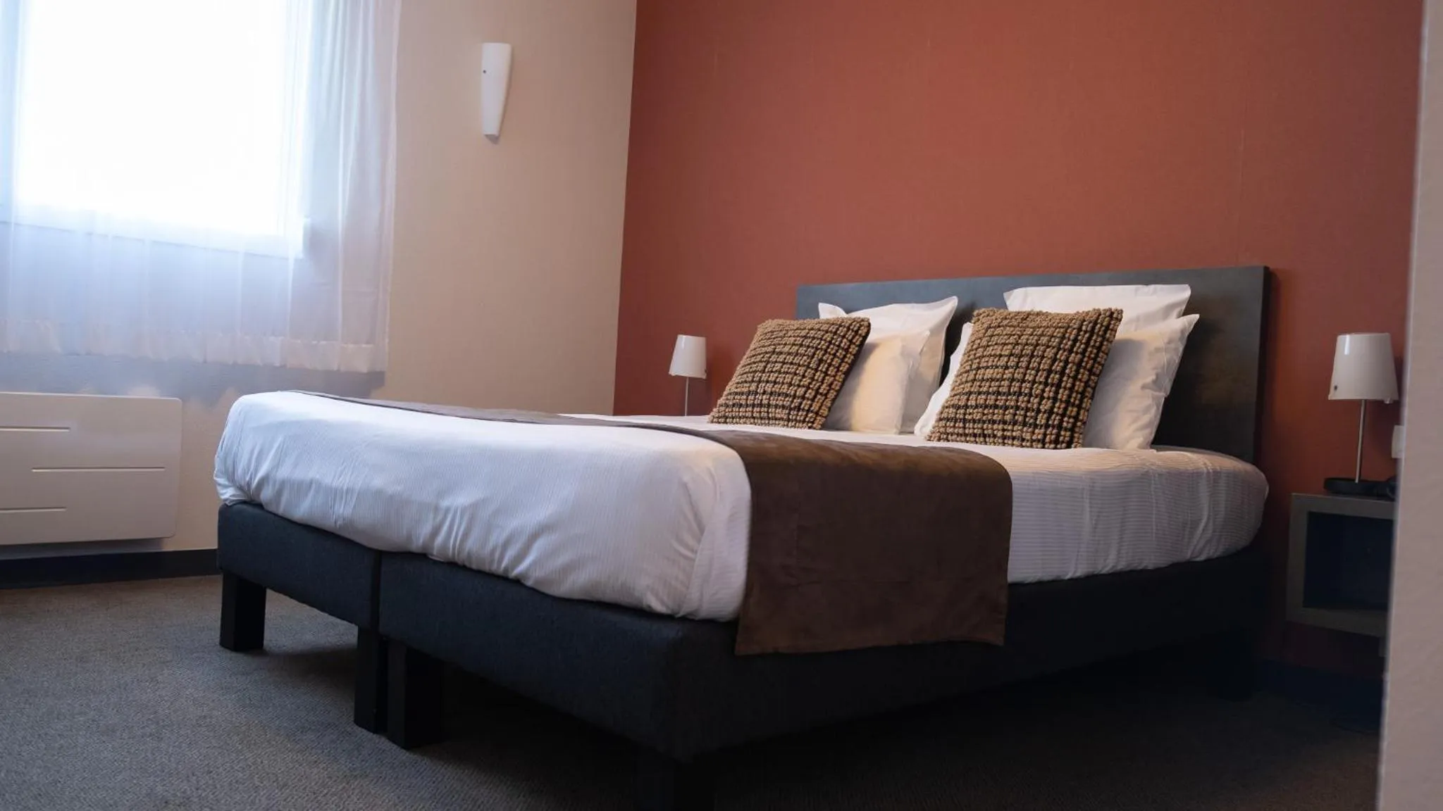 Bed in LOGIS Hôtel ARCADIA