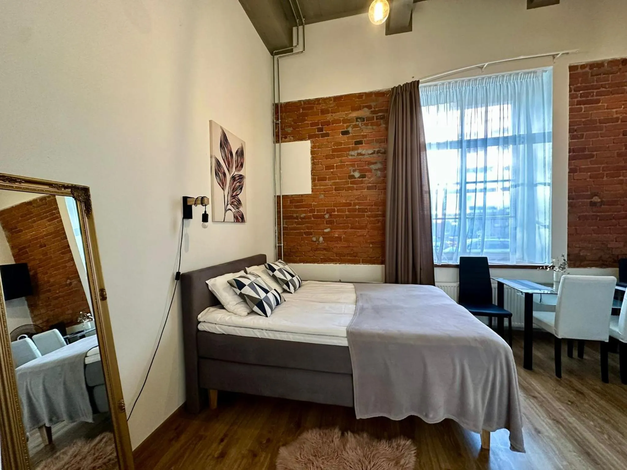 Bed in Filosoofi 1 Studio Apartments