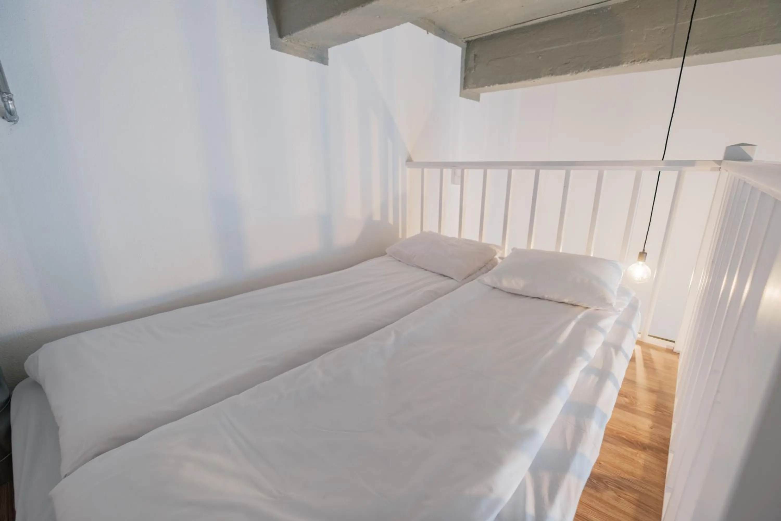 Bed in Filosoofi 1 Studio Apartments