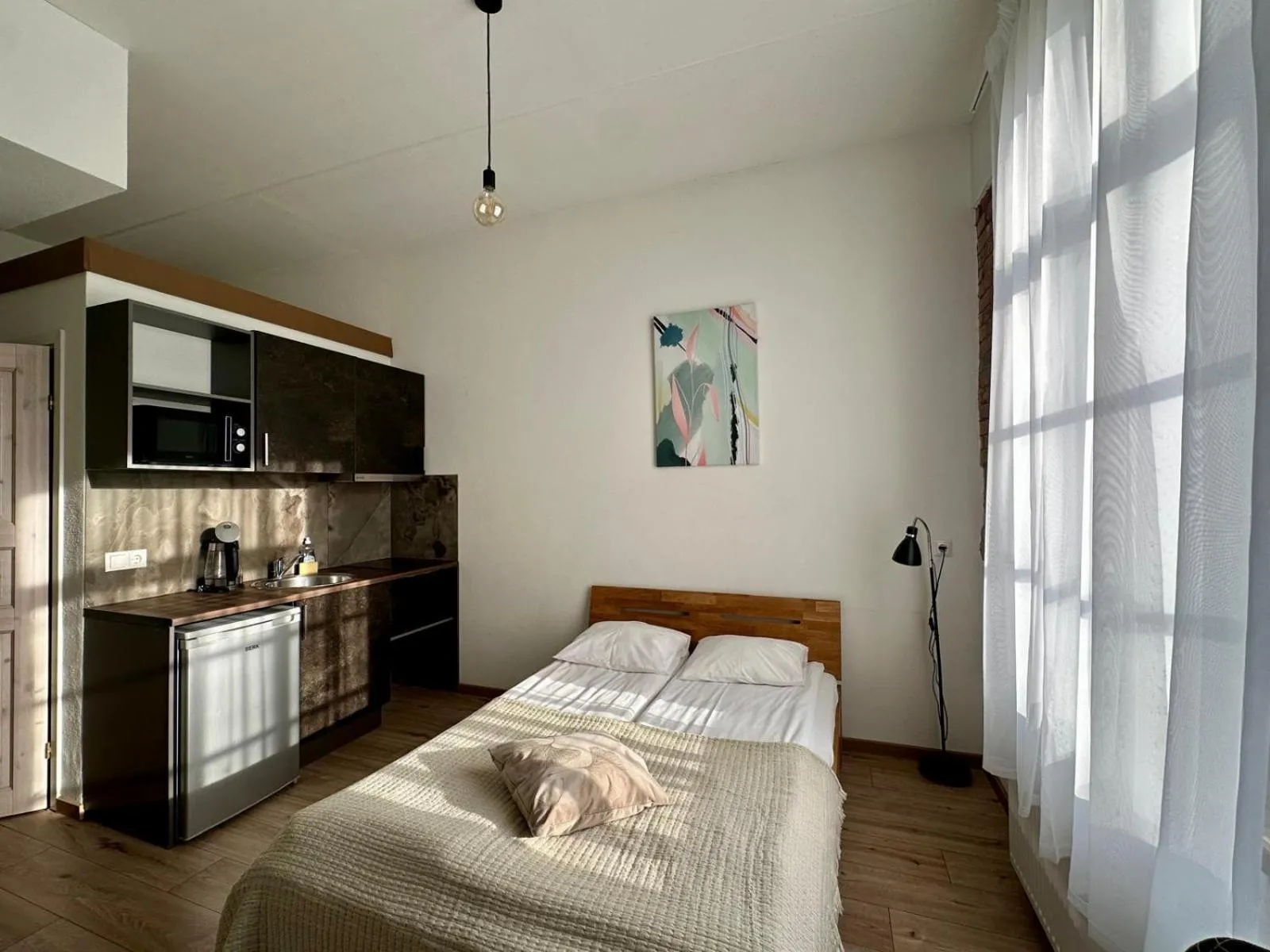Bed in Filosoofi 1 Studio Apartments