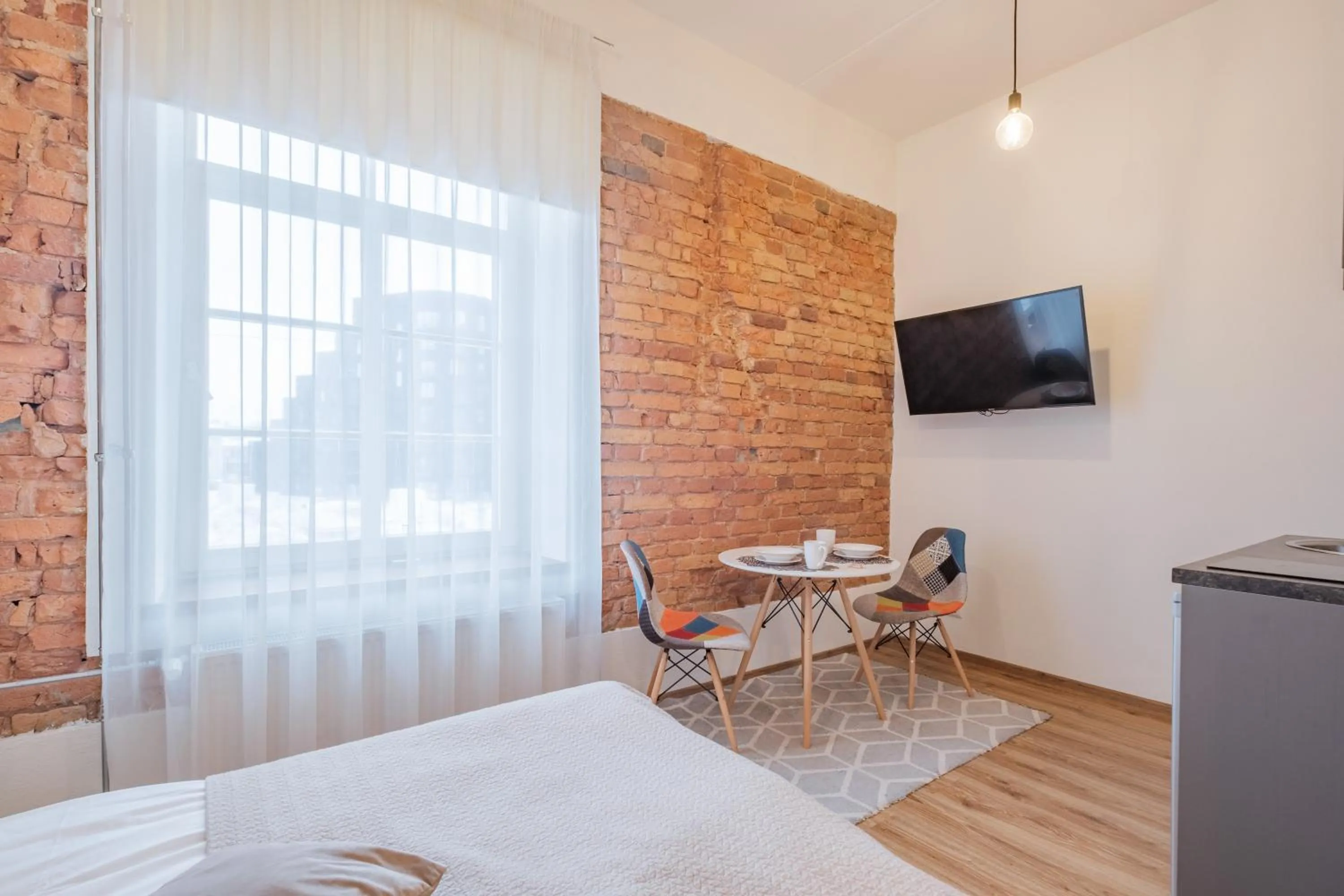 TV and multimedia, Bed in Filosoofi 1 Studio Apartments