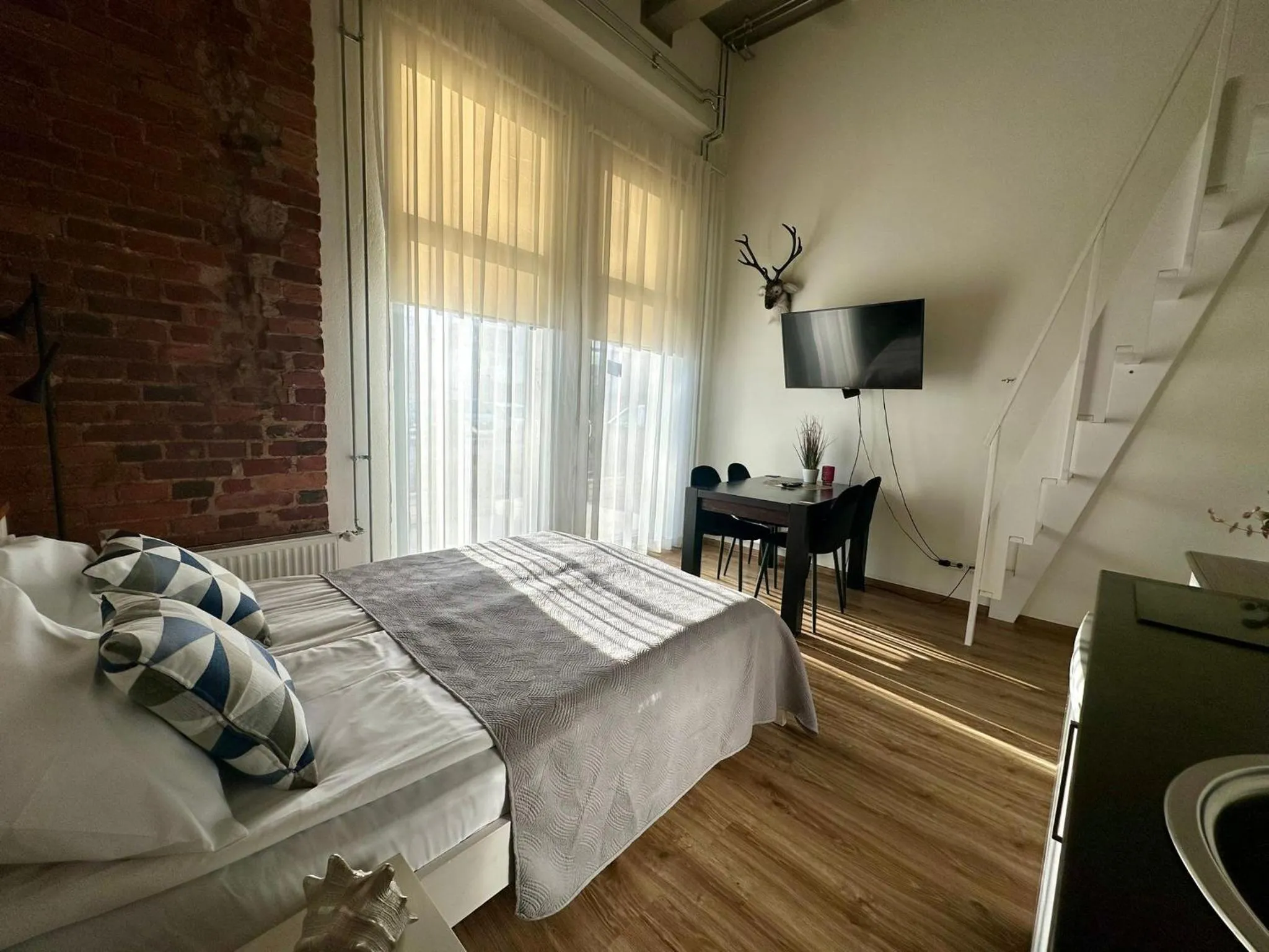 Bed in Filosoofi 1 Studio Apartments